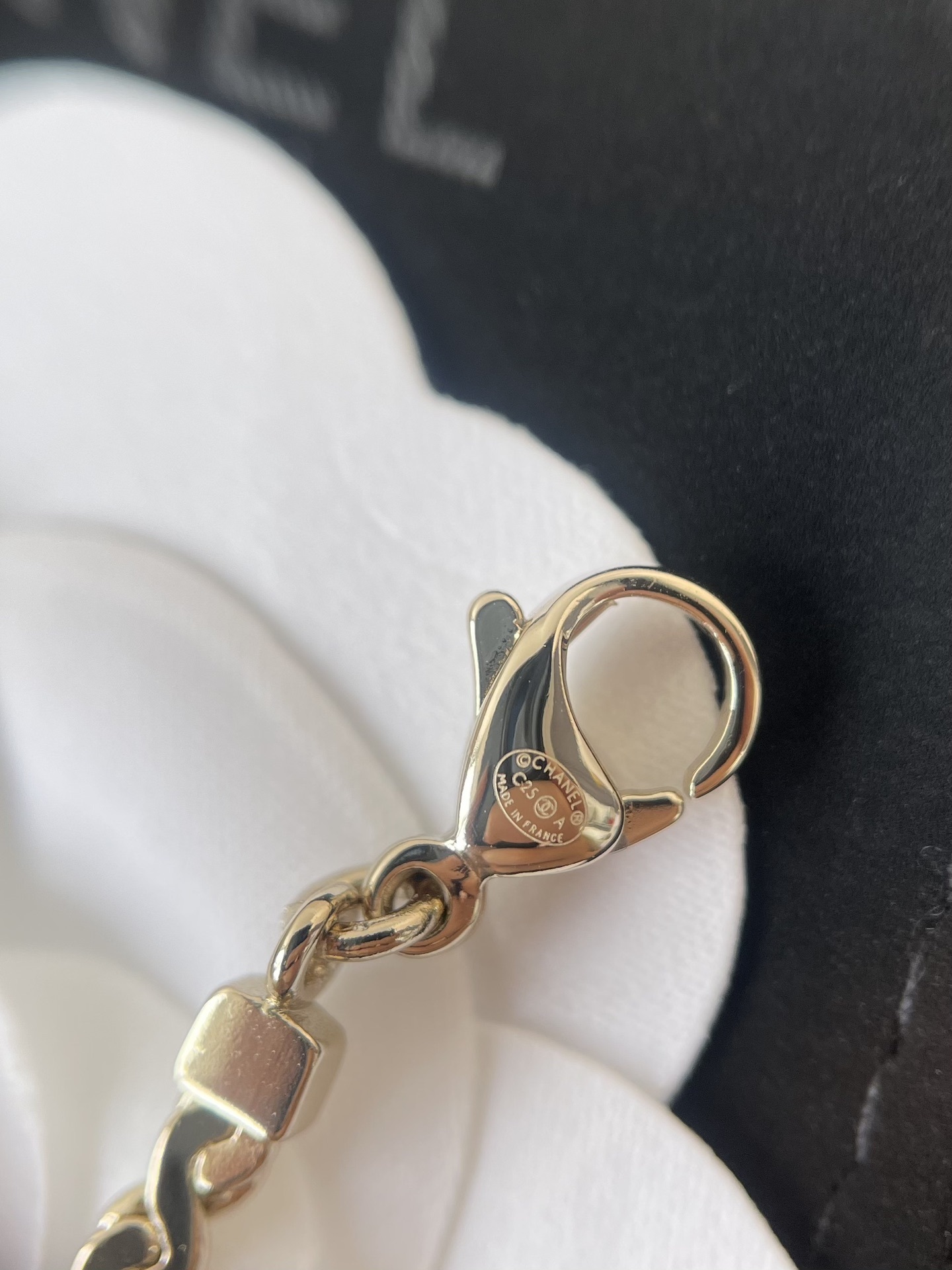 Chanel Gold CC Logo Bracelet with Black Glitter Oval Pendant