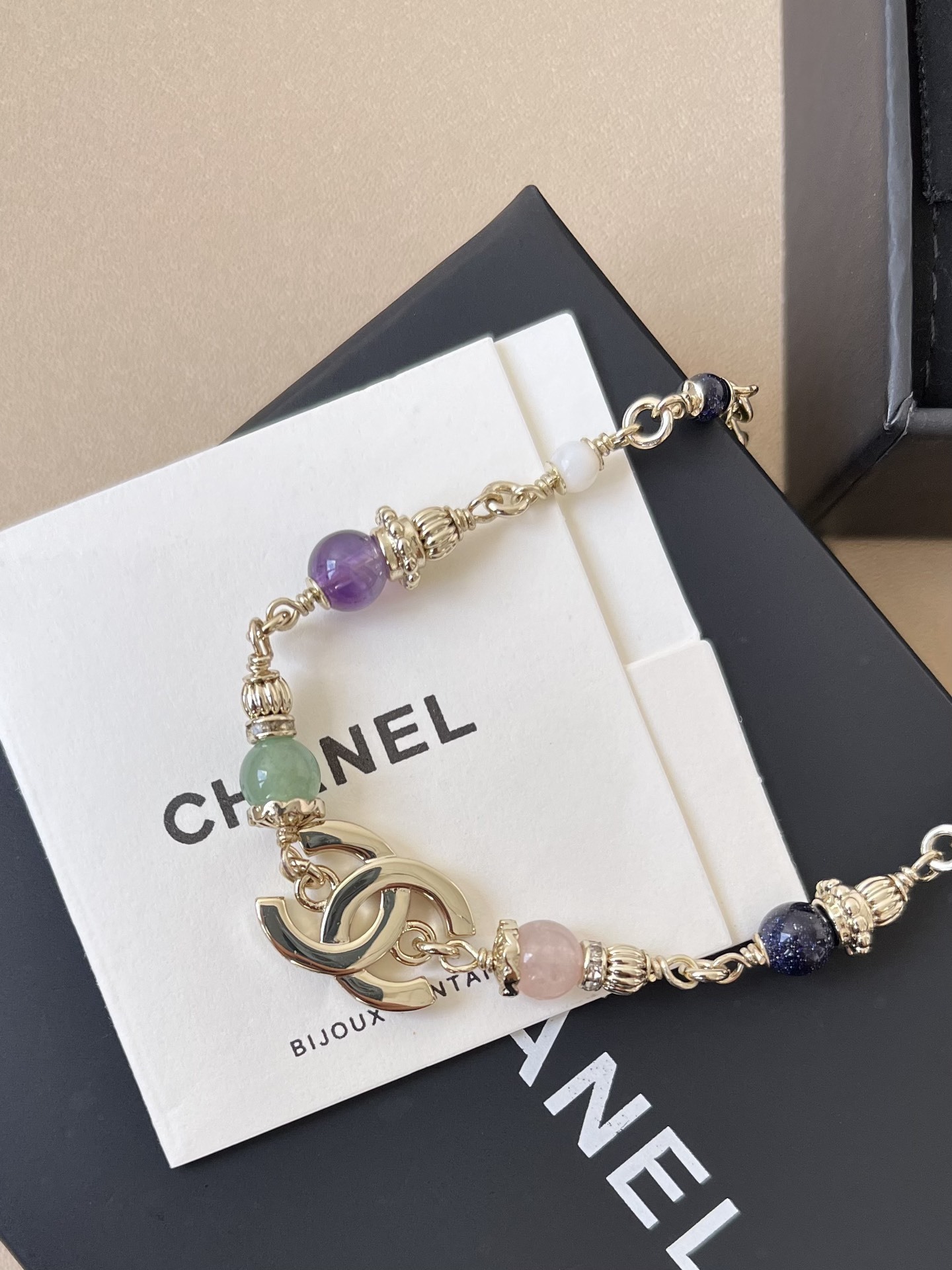 Elegant Chanel Gold-Tone Multi-Bead Charm Bracelet