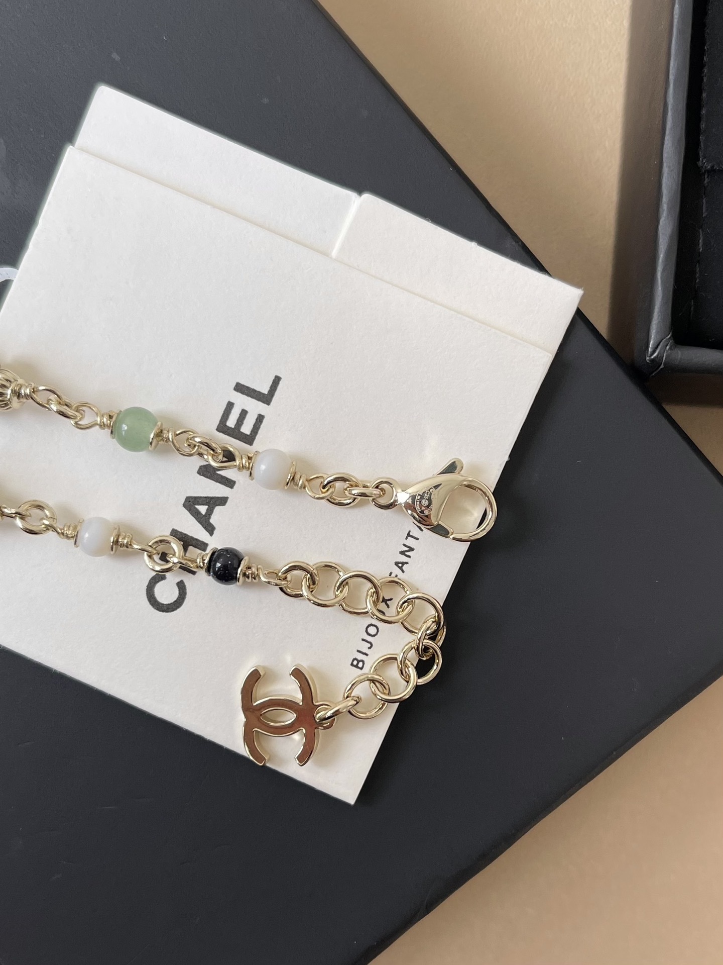 Elegant Chanel Gold-Tone Multi-Bead Charm Bracelet