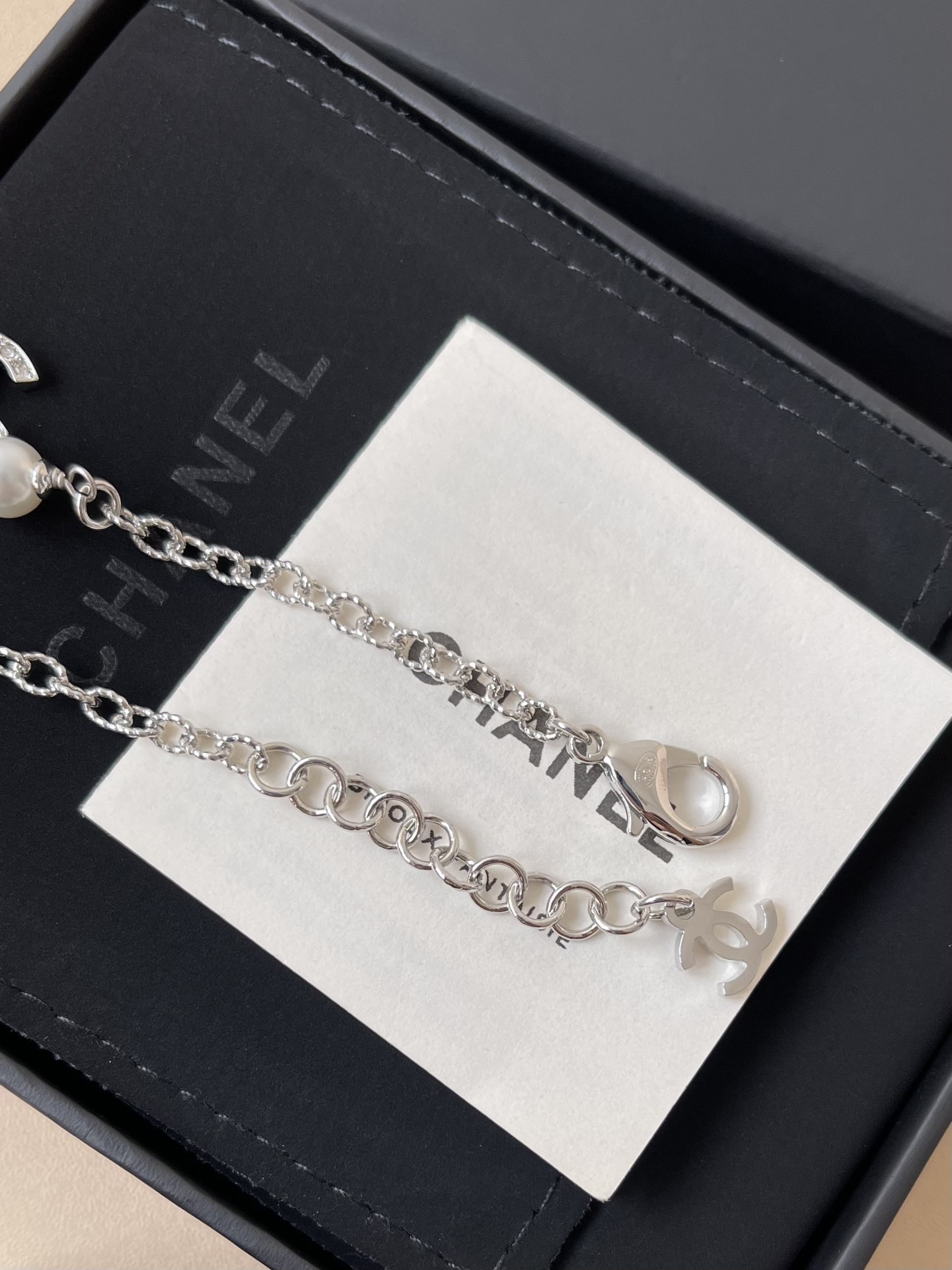 Elegant Silver CC Bracelet with Pearls and Crystal Star Charm