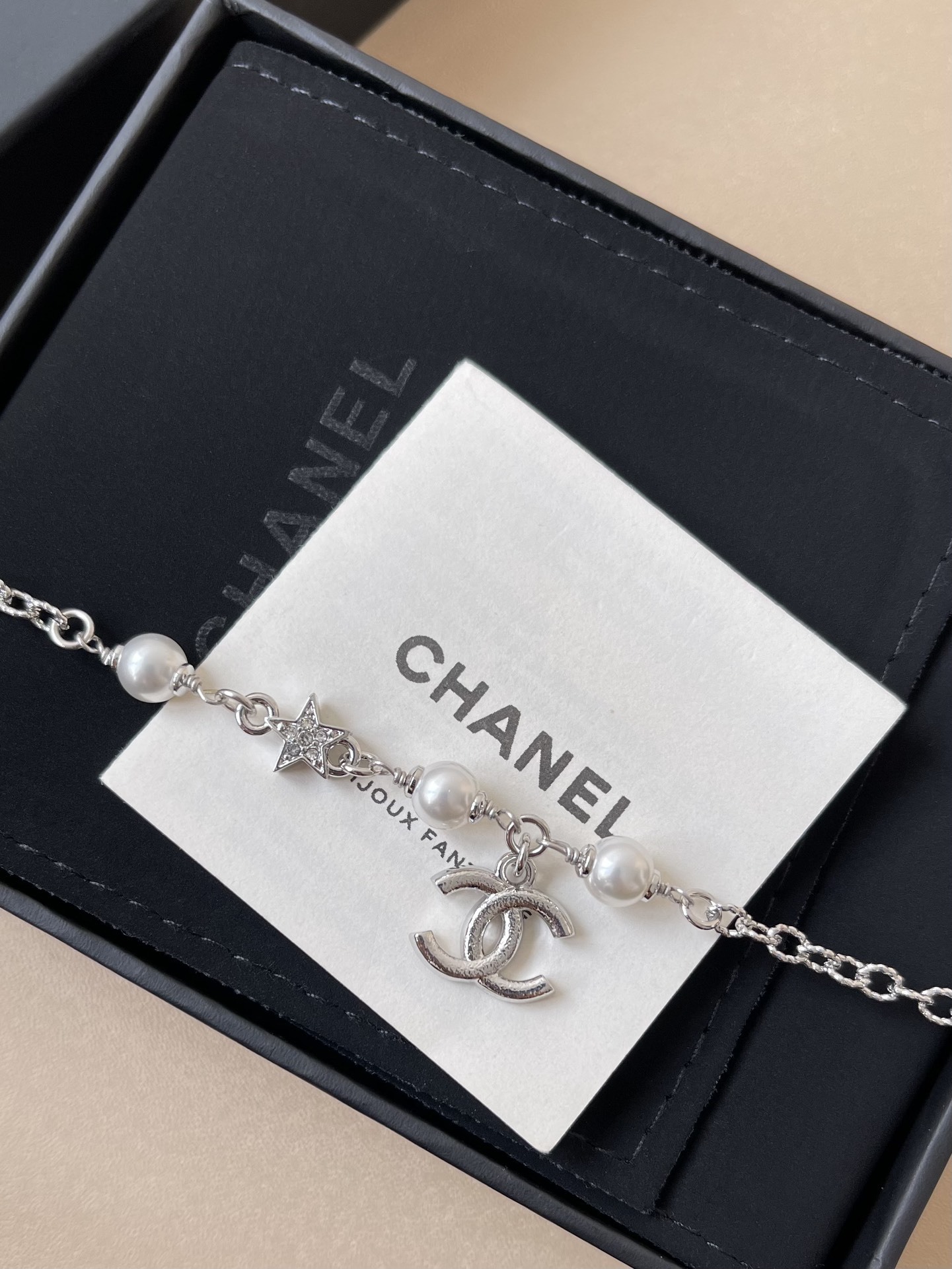 Elegant Silver CC Bracelet with Pearls and Crystal Star Charm