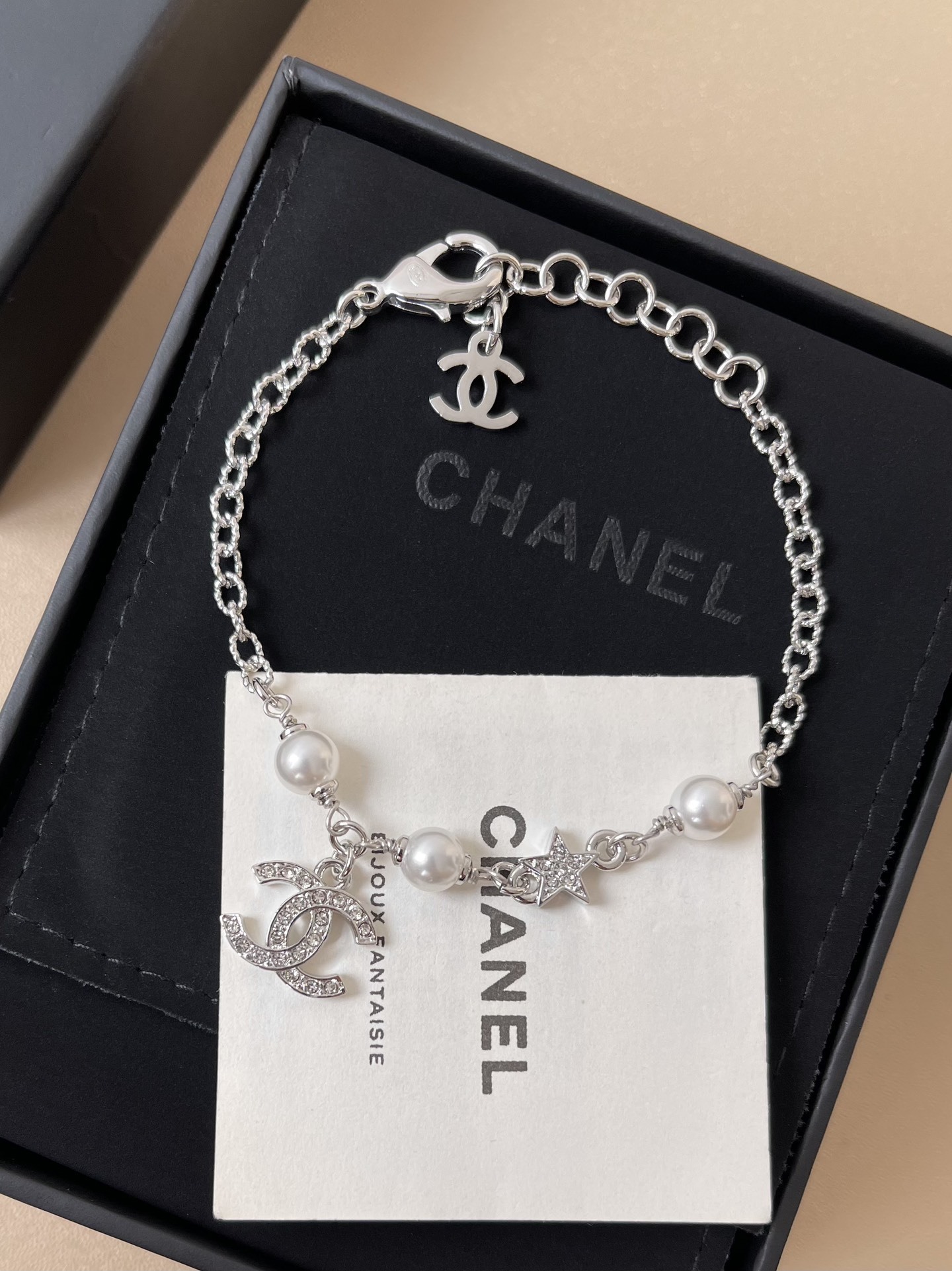 Elegant Silver CC Bracelet with Pearls and Crystal Star Charm