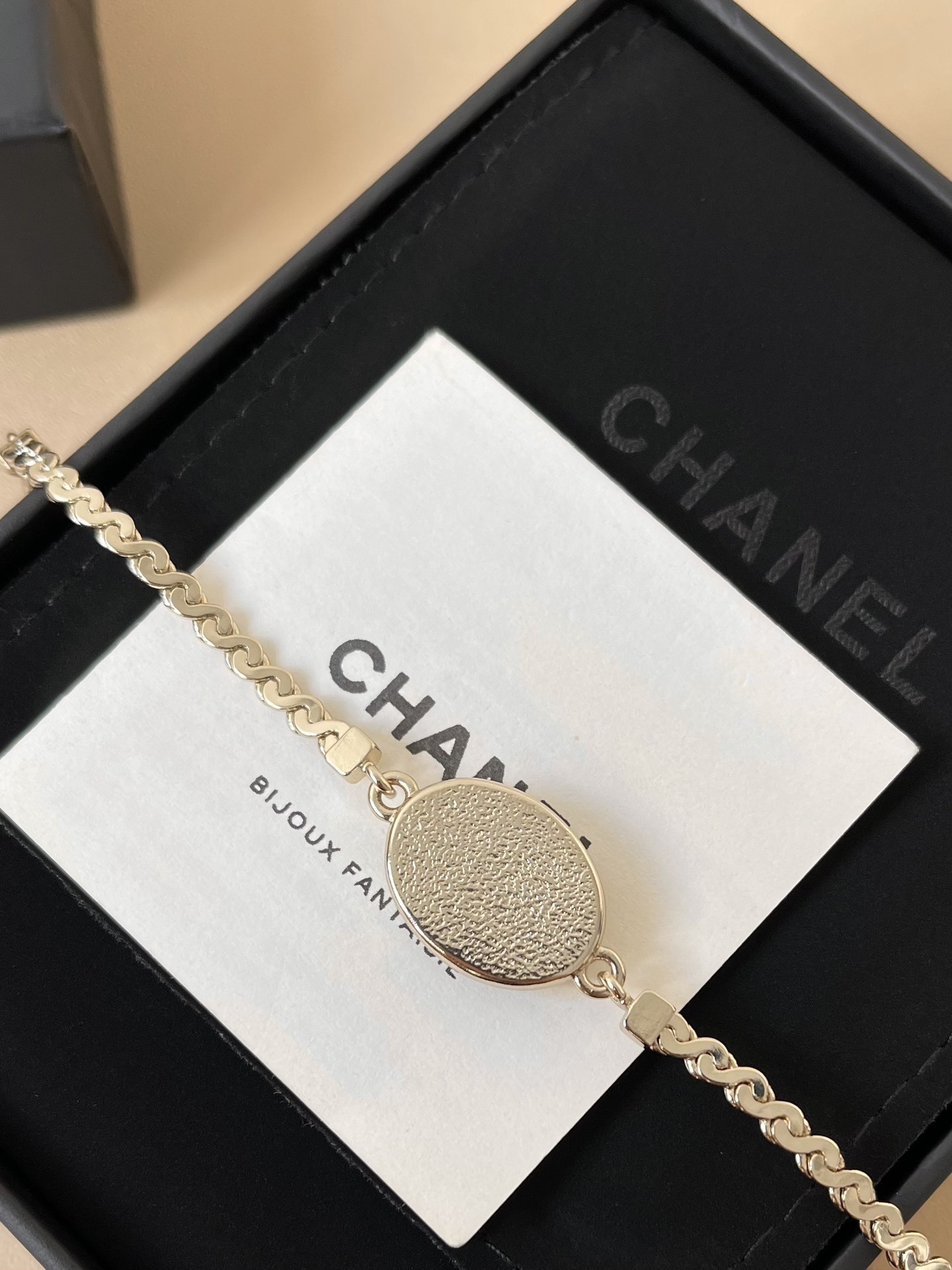 Chanel Gold-Tone Oval CC Logo Bracelet with Glitter Detail