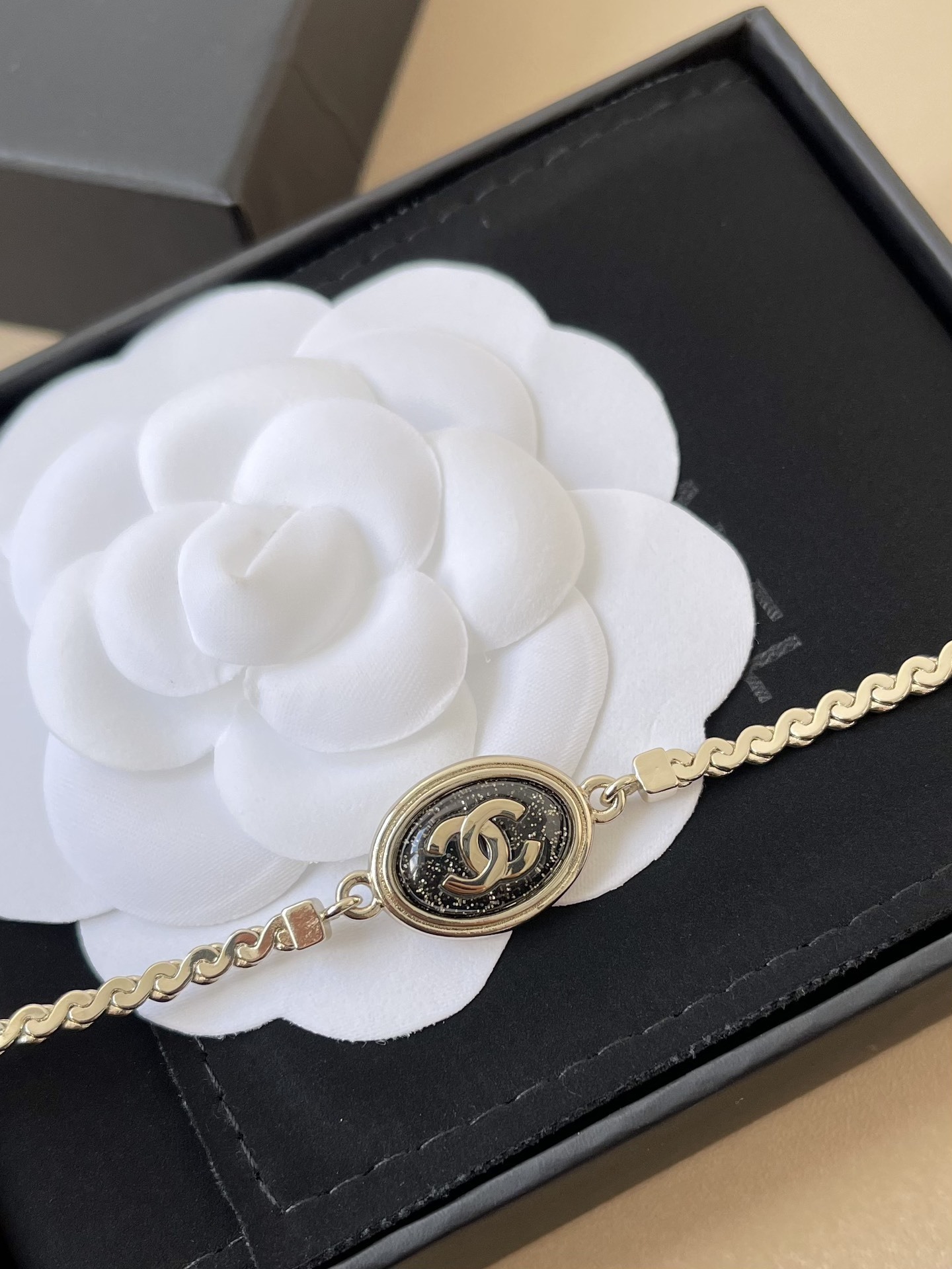 Chanel Gold-Tone Oval CC Logo Bracelet with Glitter Detail