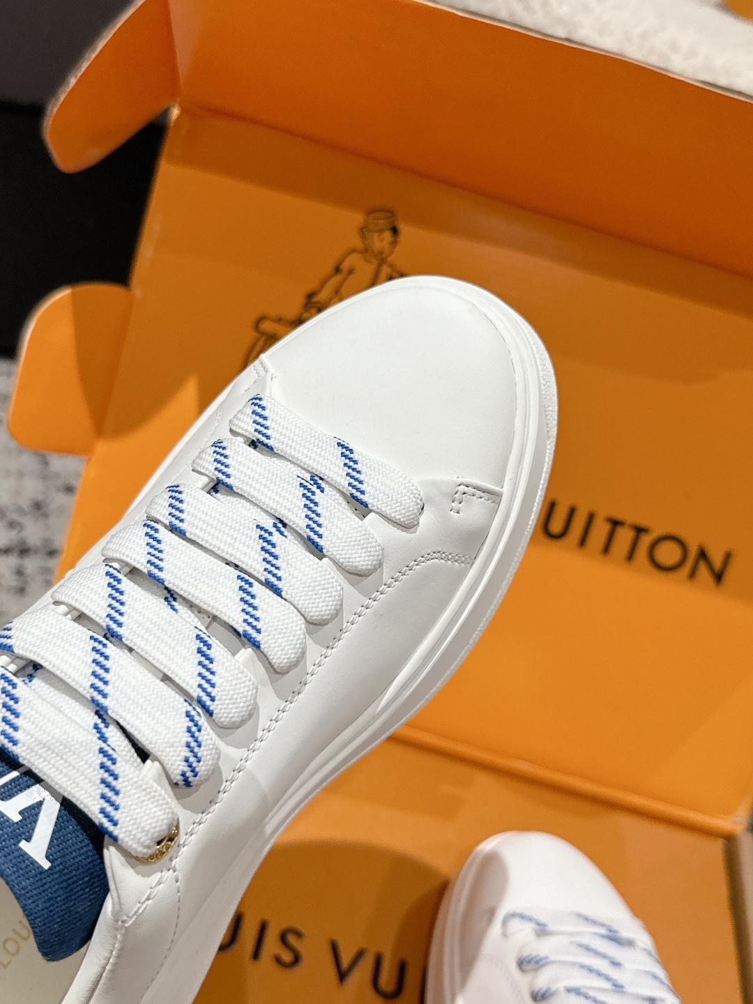 Louis Vuitton Luxury White Leather Sneakers with Blue Accents