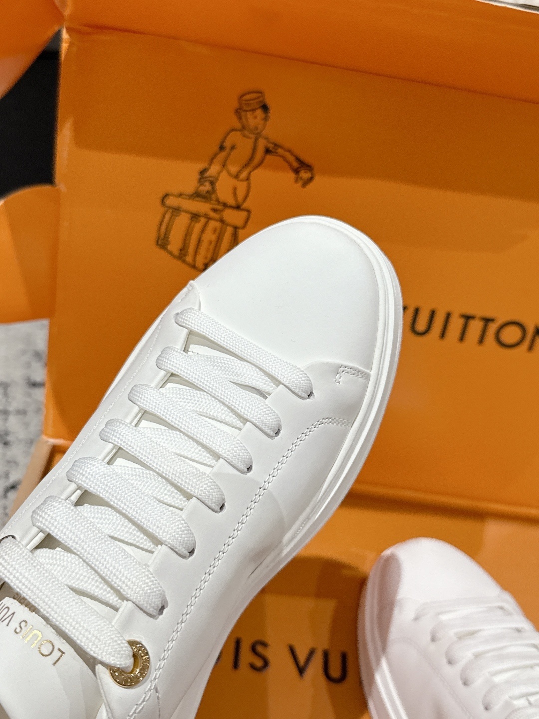 Louis Vuitton Women's White Leather Sneakers with Pink Floral Charm