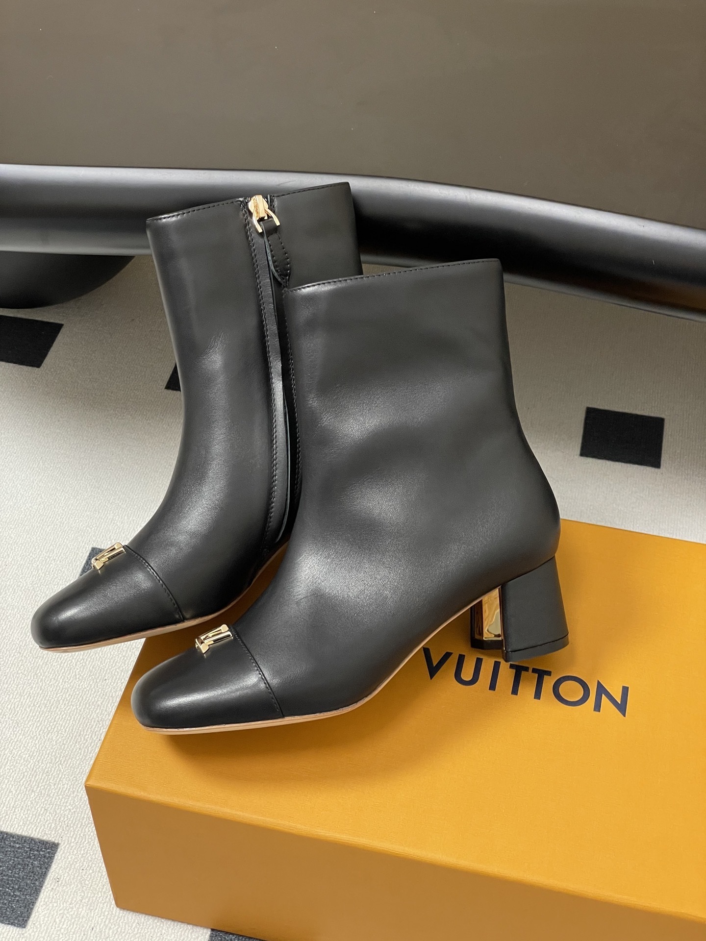Luxury Black Leather Ankle Boots with Gold LV Initials