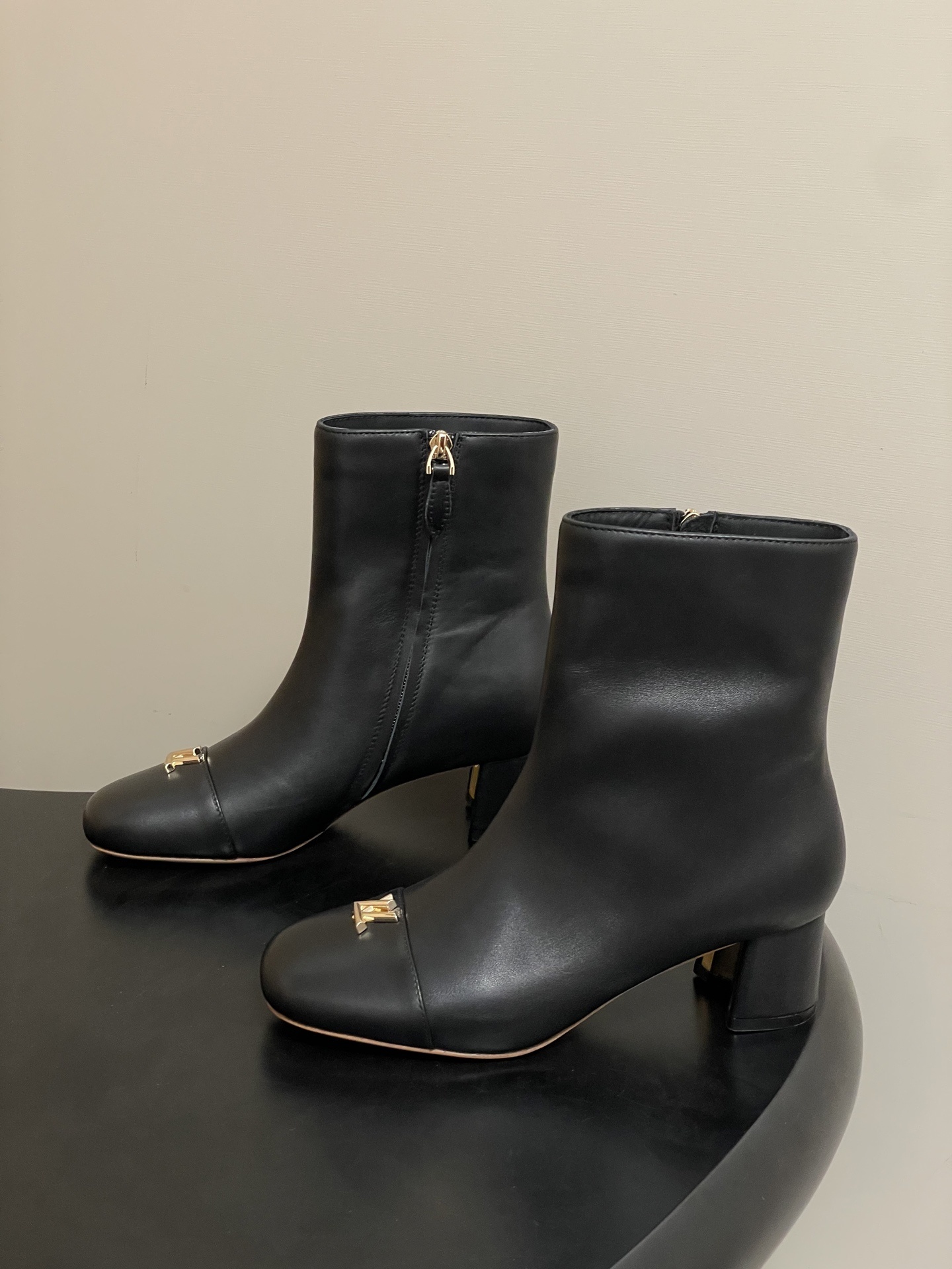 Luxury Black Leather Ankle Boots with Gold LV Initials