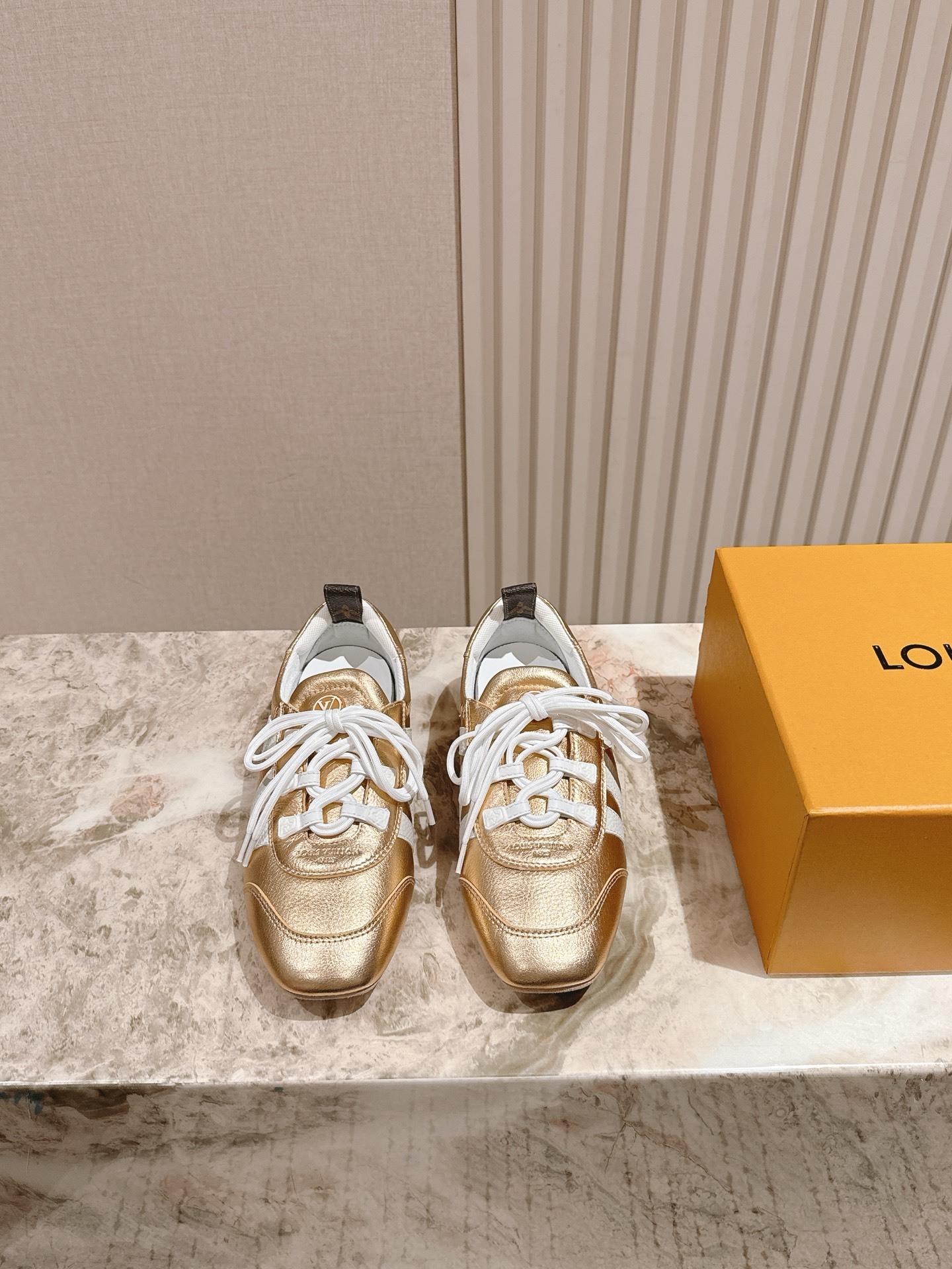 Louis Vuitton Women’s Gold Metallic Leather Sneakers