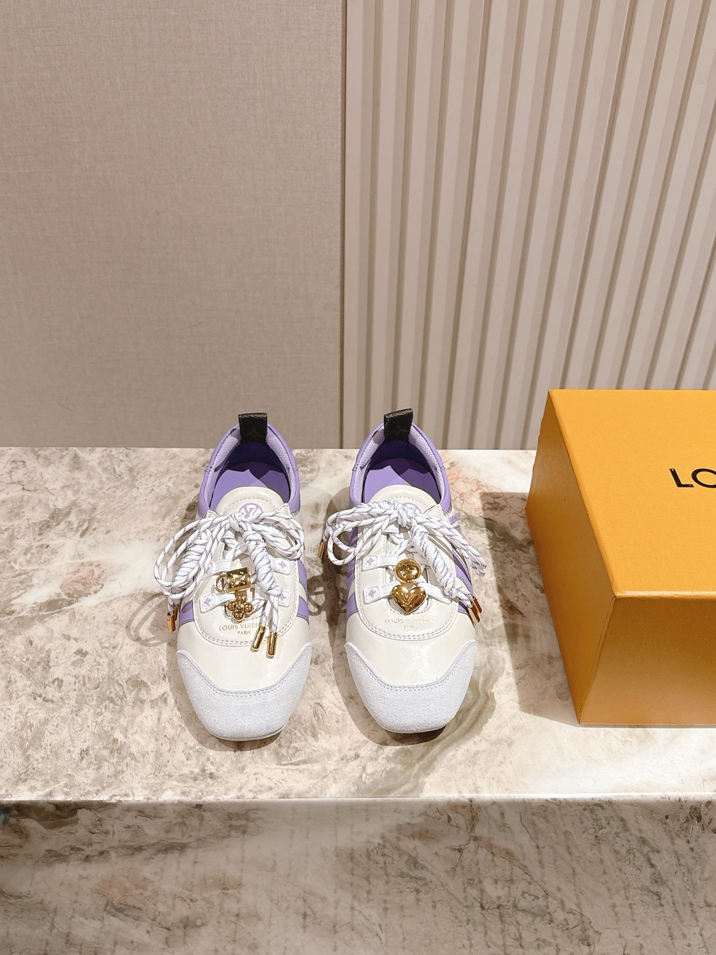 Louis Vuitton Women’s White and Lavender Sneakers with Gold Charms