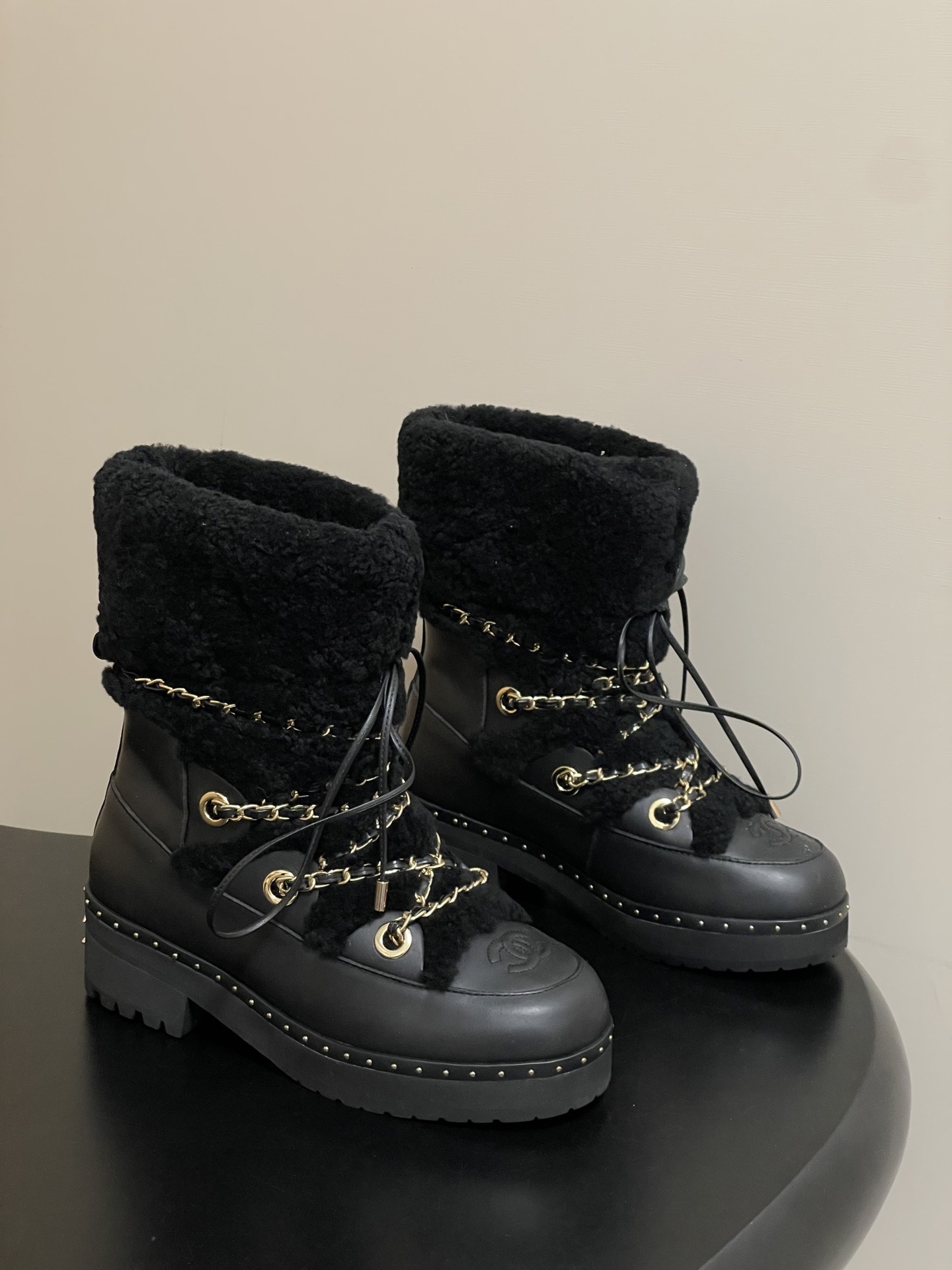 Chanel Black Leather and Shearling Lace-Up Boots with Gold Chains