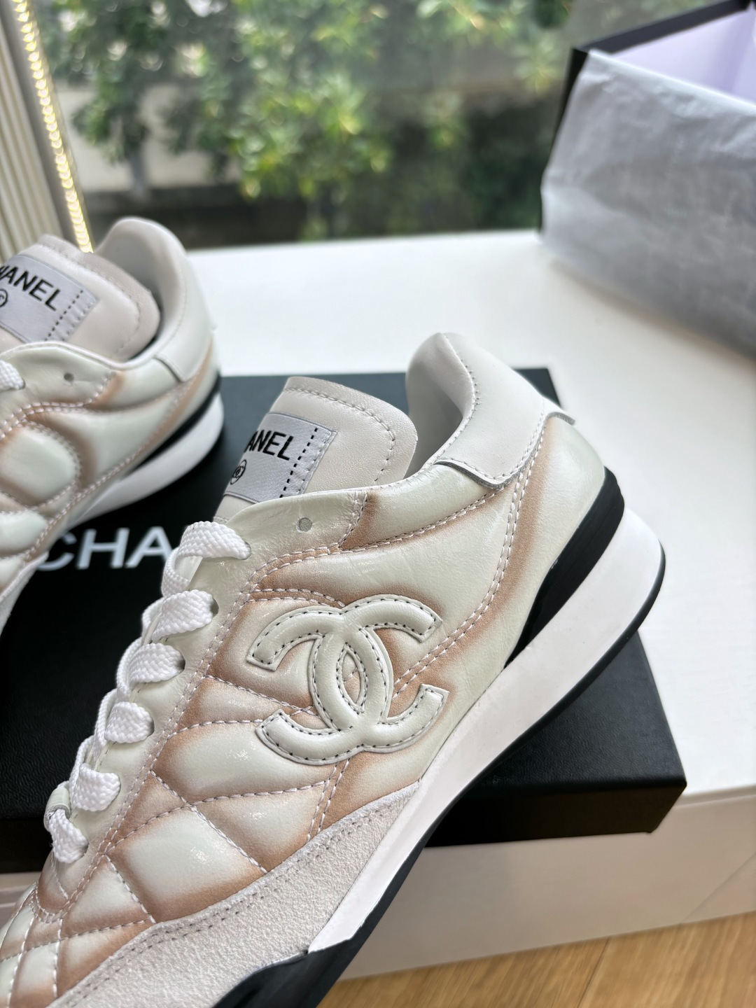 Luxury Chanel quilted leather sneakers in white with peach gradient accents and interlocking CC logo - Hình 8