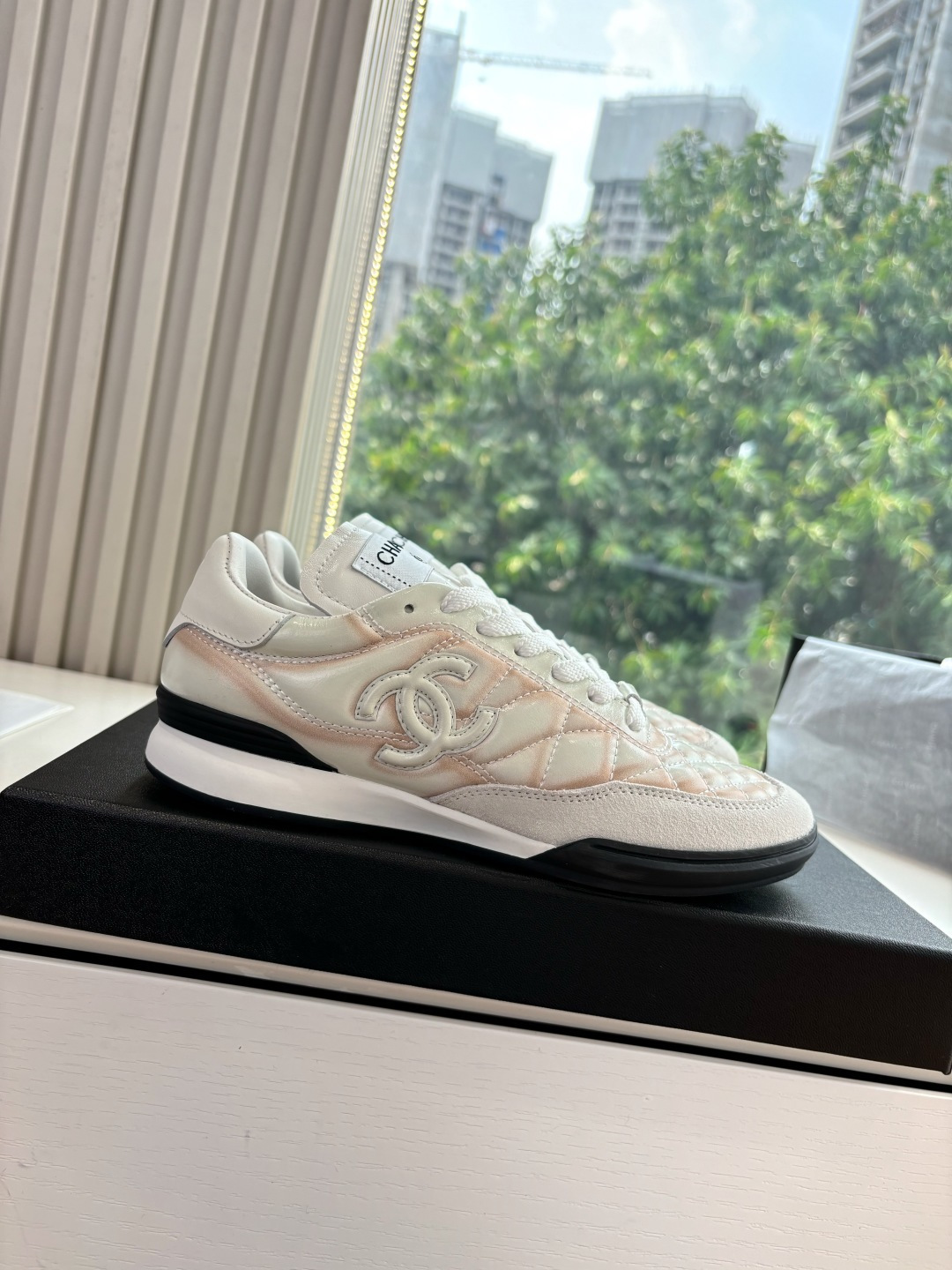 Luxury Chanel quilted leather sneakers in white with peach gradient accents and interlocking CC logo - Hình 7