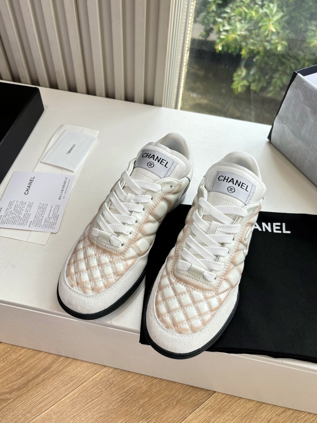 Luxury Chanel quilted leather sneakers in white with peach gradient accents and interlocking CC logo - Hình 4