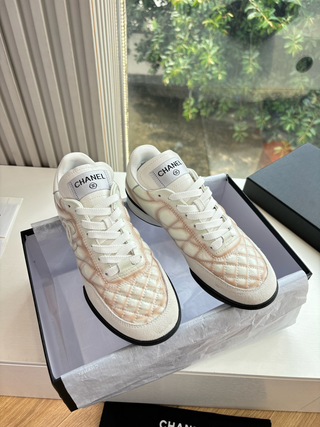 Chanel Women’s Quilted Sneakers – Elegant White & Peach Luxury Shoes