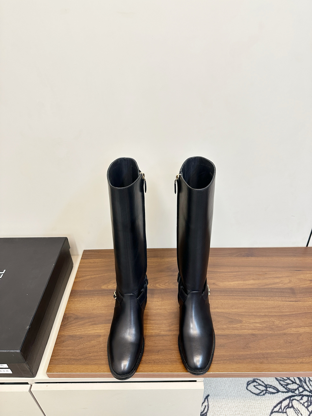 Luxury Chanel Black Leather Knee-High Boots with Gold Chain Detail