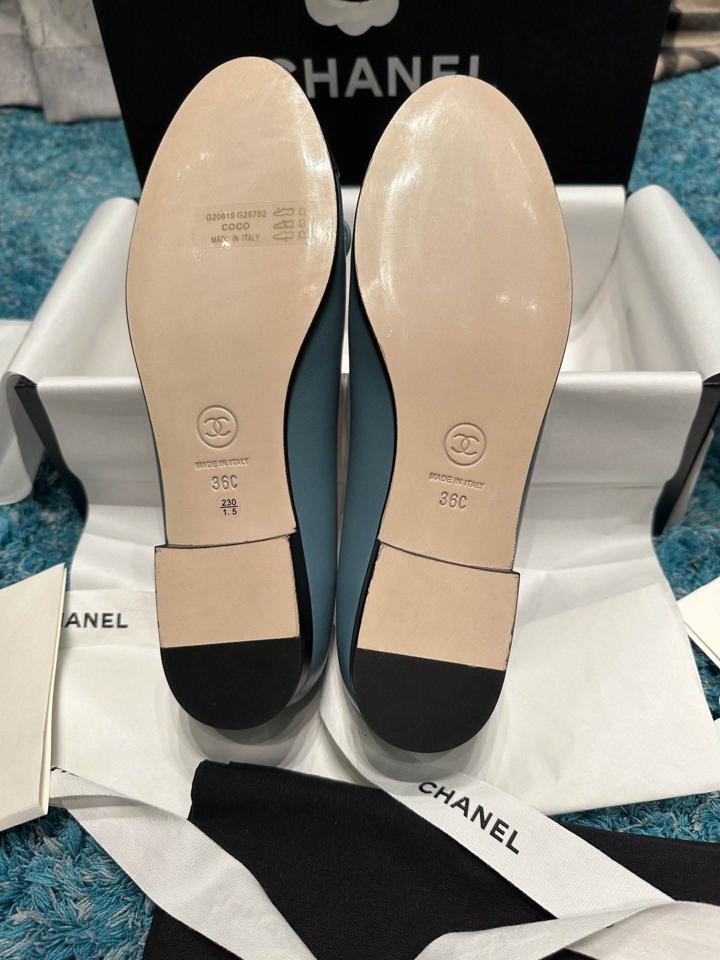 Pair of blue Chanel ballet flats with black toe caps and bow details in original packaging - Hình 4