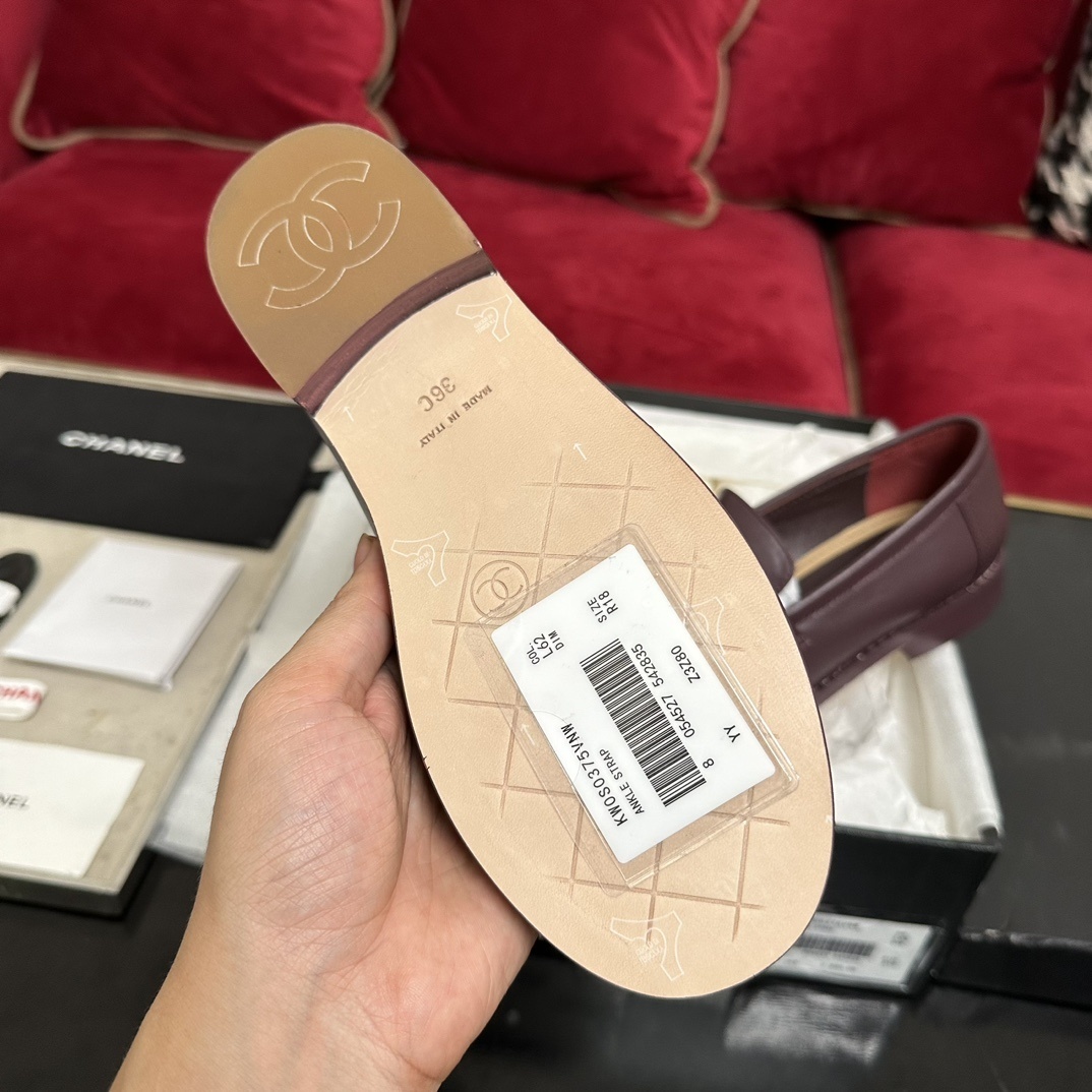 Authentic burgundy Chanel leather loafers with gold CC logo hardware presented in their original designer box - Hình 9