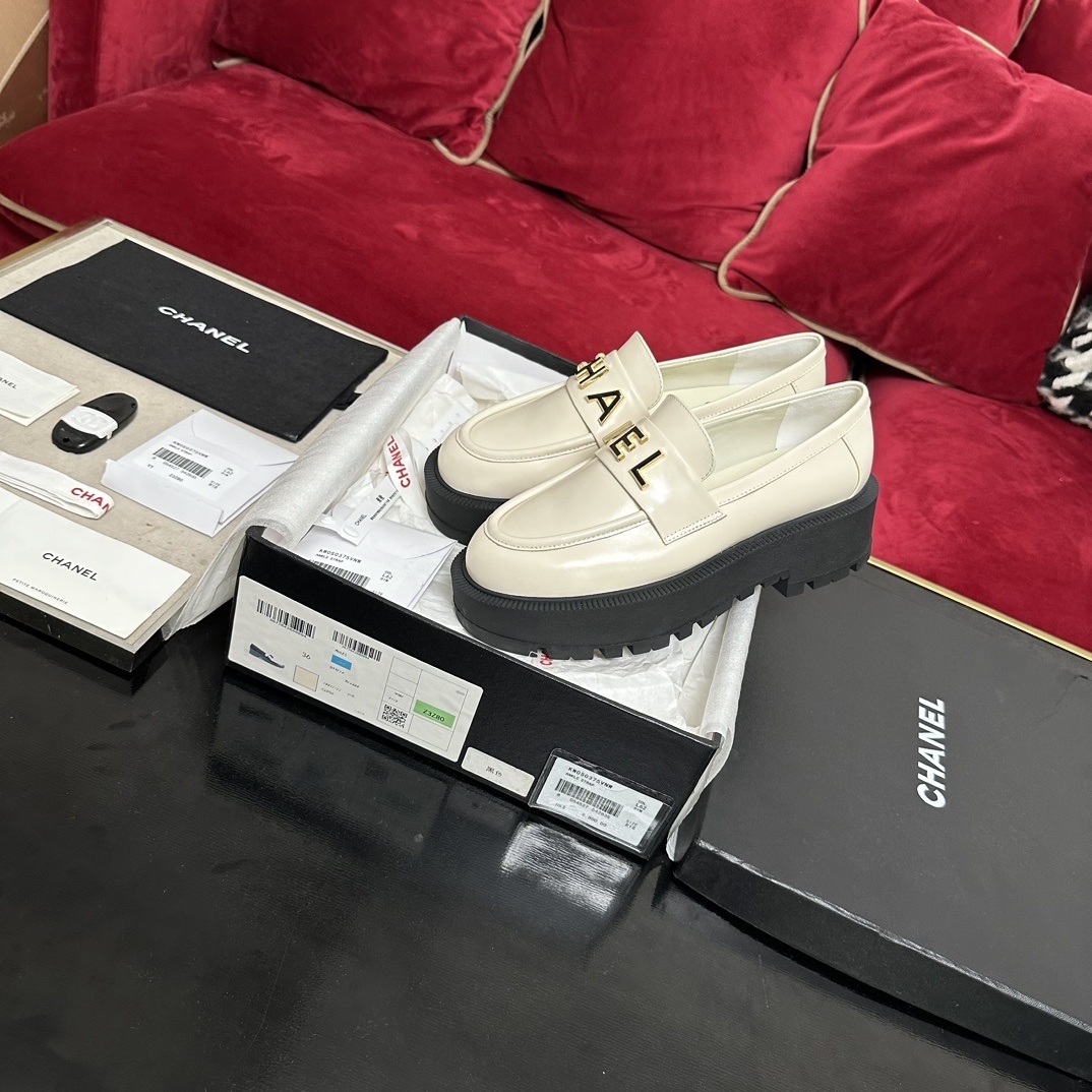 Chanel Cream Leather Platform Loafers with Gold Logo Lettering