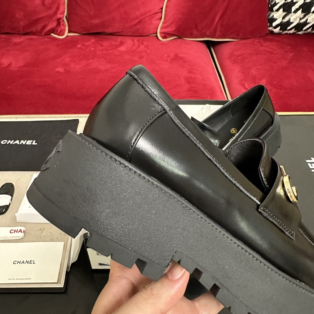 Pair of Chanel black leather platform loafers with gold-tone CHANEL logo lettering on the strap and chunky lug soles. - Hình 8