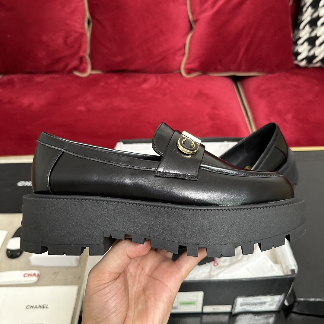 Pair of Chanel black leather platform loafers with gold-tone CHANEL logo lettering on the strap and chunky lug soles. - Hình 5