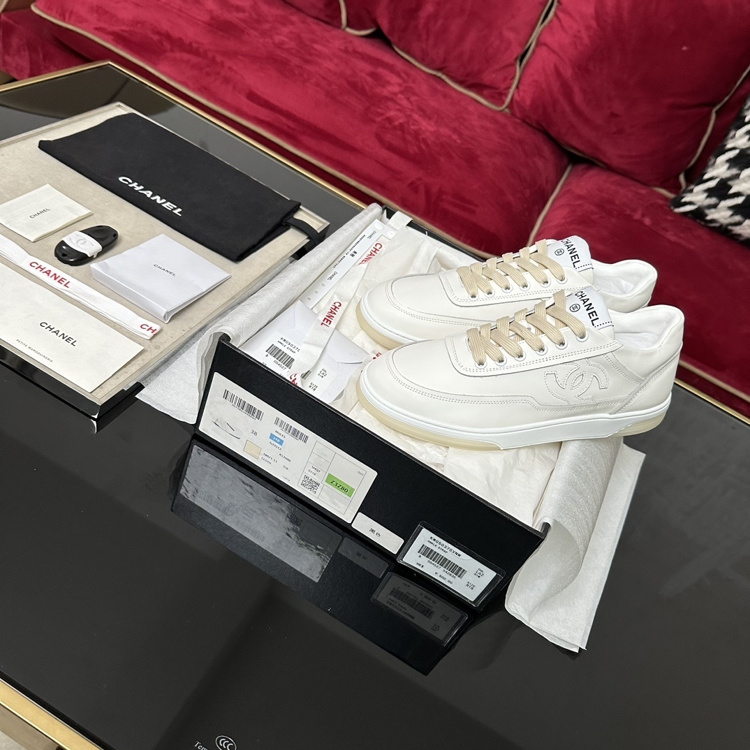 Chanel Women’s White Leather Sneakers with Interlocking CC Logo