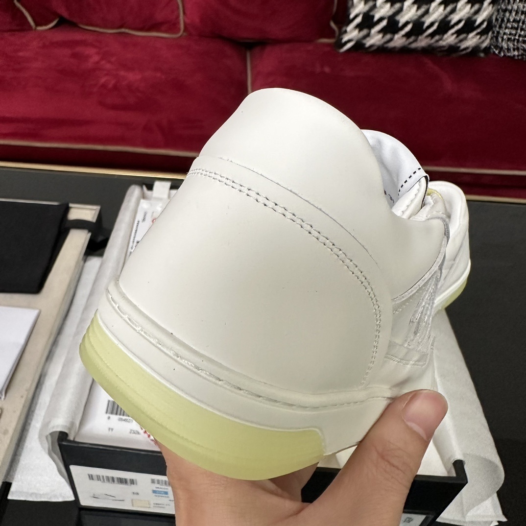 Pair of Chanel white leather sneakers with yellow laces and translucent yellow sole in a black designer box - Hình 8