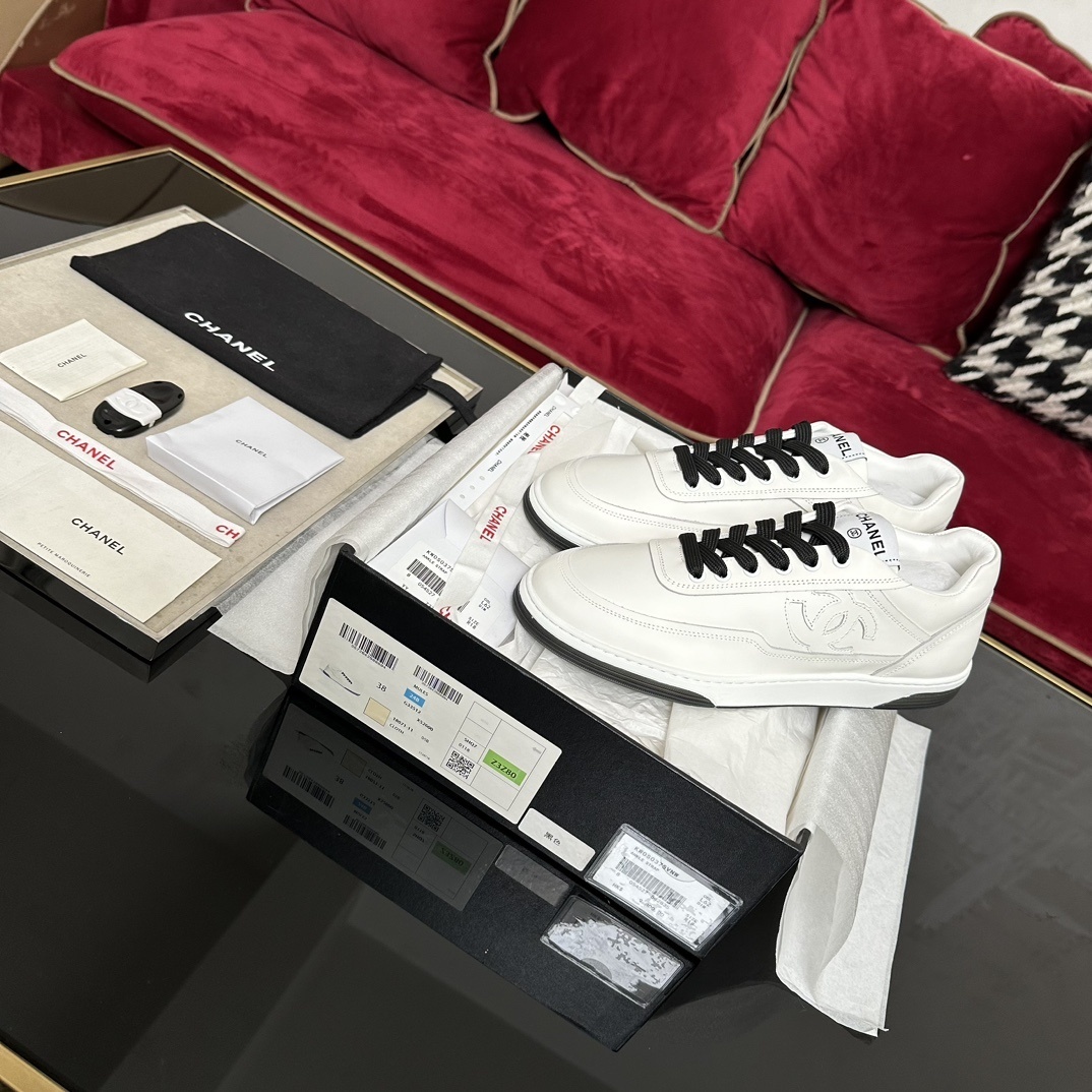 Chanel White Leather Sneakers with Black Laces & Embossed CC Logo