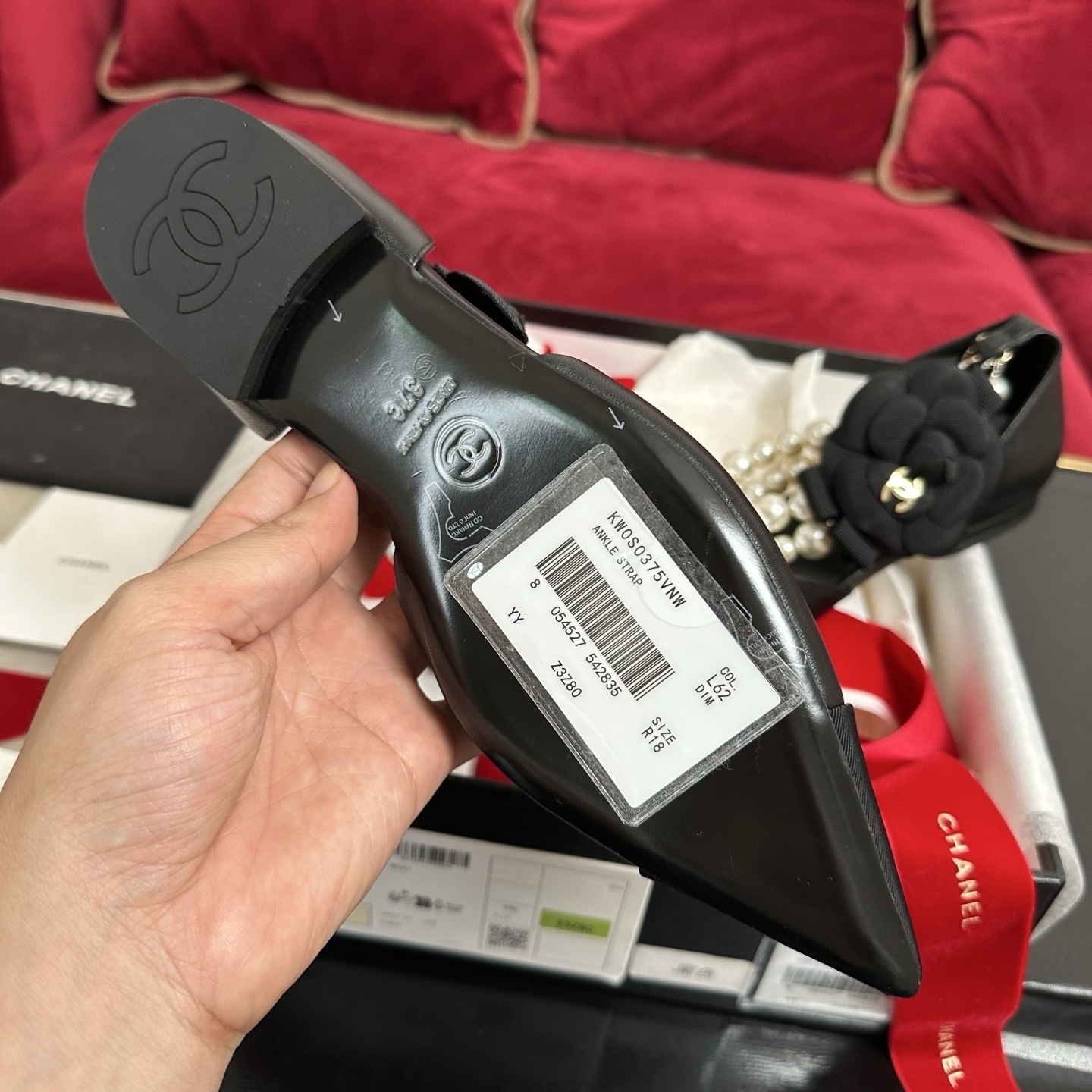 Chanel black leather pointed-toe flats with multi-strand pearl ankle straps and black camellia flower ornaments in a designer box - Hình 9