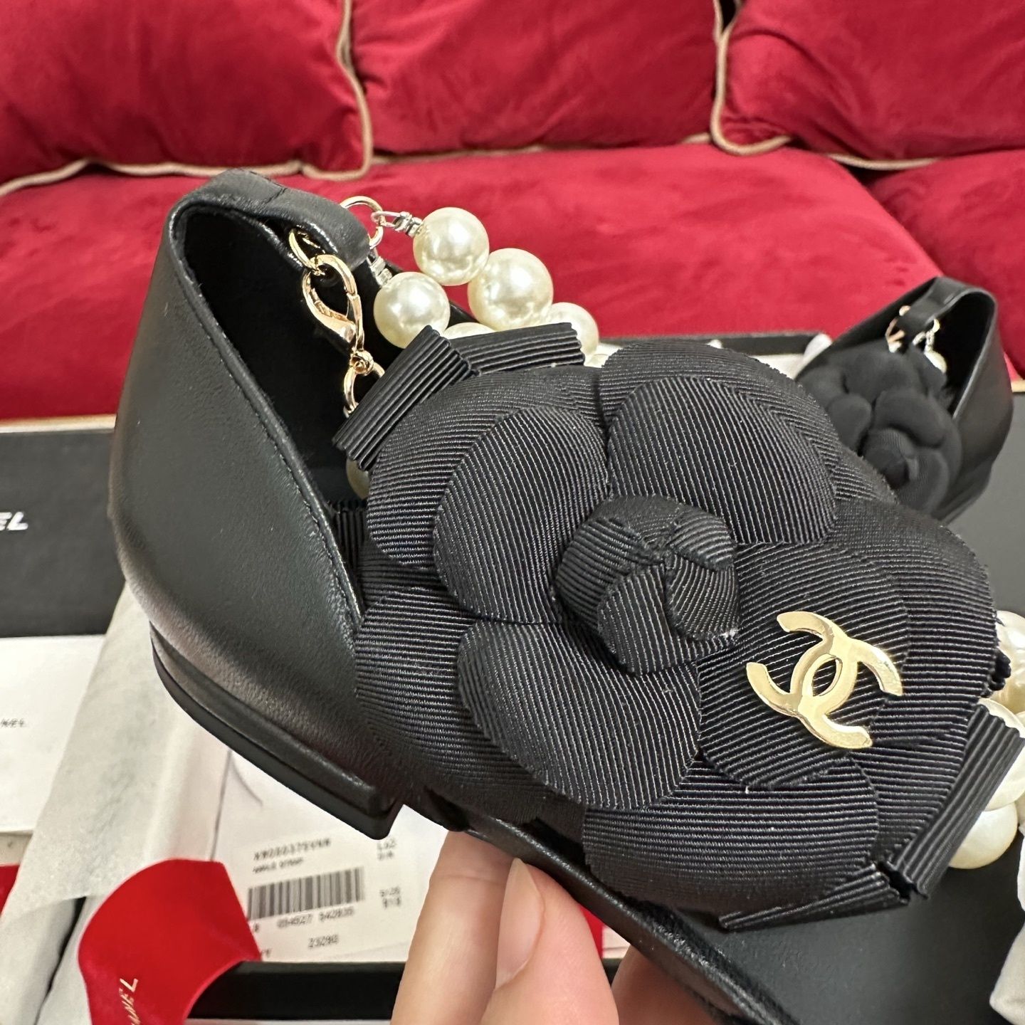 Chanel black leather pointed-toe flats with multi-strand pearl ankle straps and black camellia flower ornaments in a designer box - Hình 7