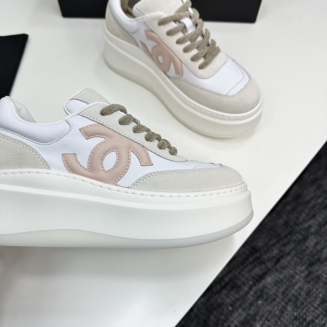 Chanel white and pink platform sneakers displayed on a black box with a branded dust bag - Hình 10