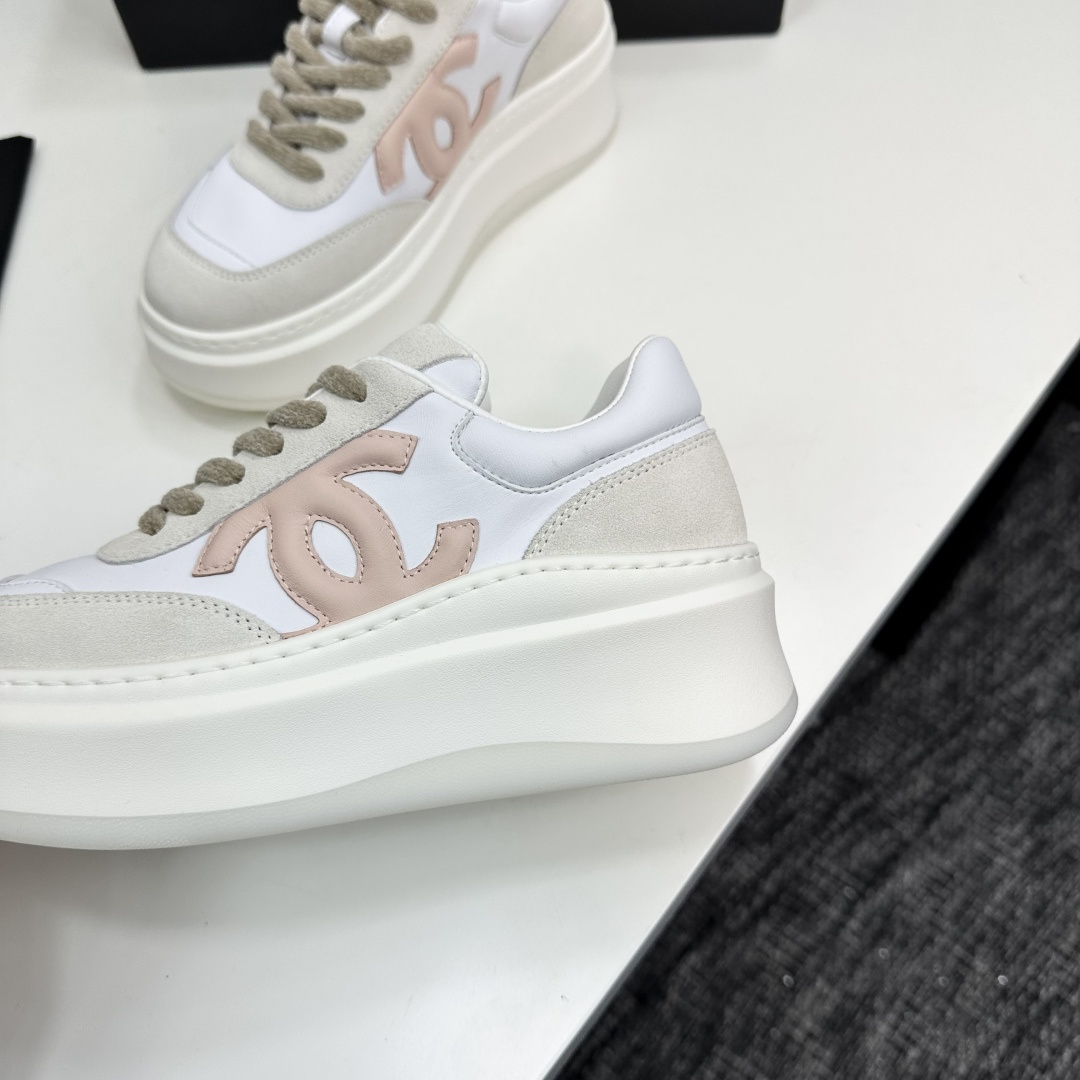Chanel white and pink platform sneakers displayed on a black box with a branded dust bag - Hình 7