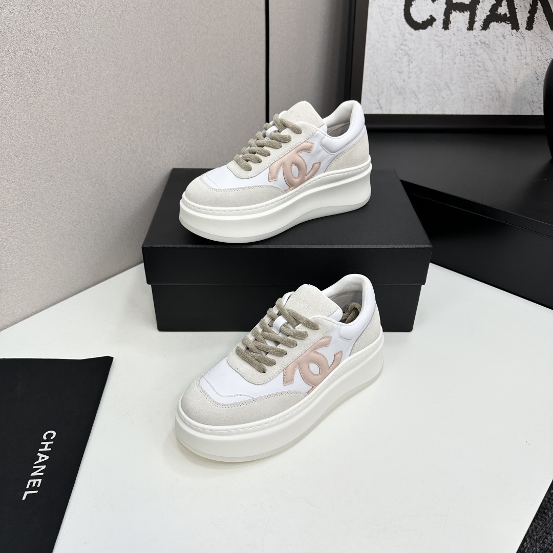 Chanel white and pink platform sneakers displayed on a black box with a branded dust bag - Hình 3