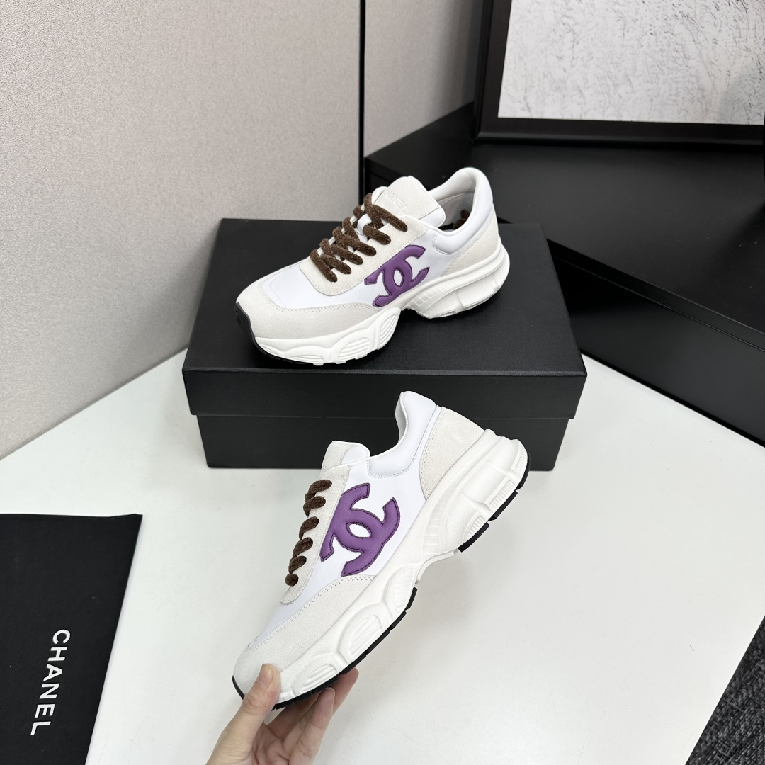Luxury Chanel sneakers in white leather and beige suede featuring a purple CC logo and chunky white sole. - Hình 4