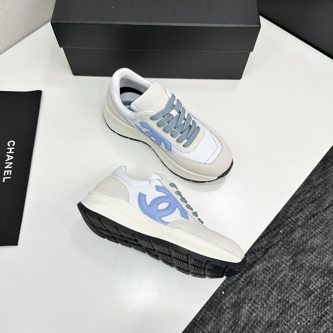 A pair of Chanel sneakers in white and light blue featuring the CC logo on the side - Hình 11