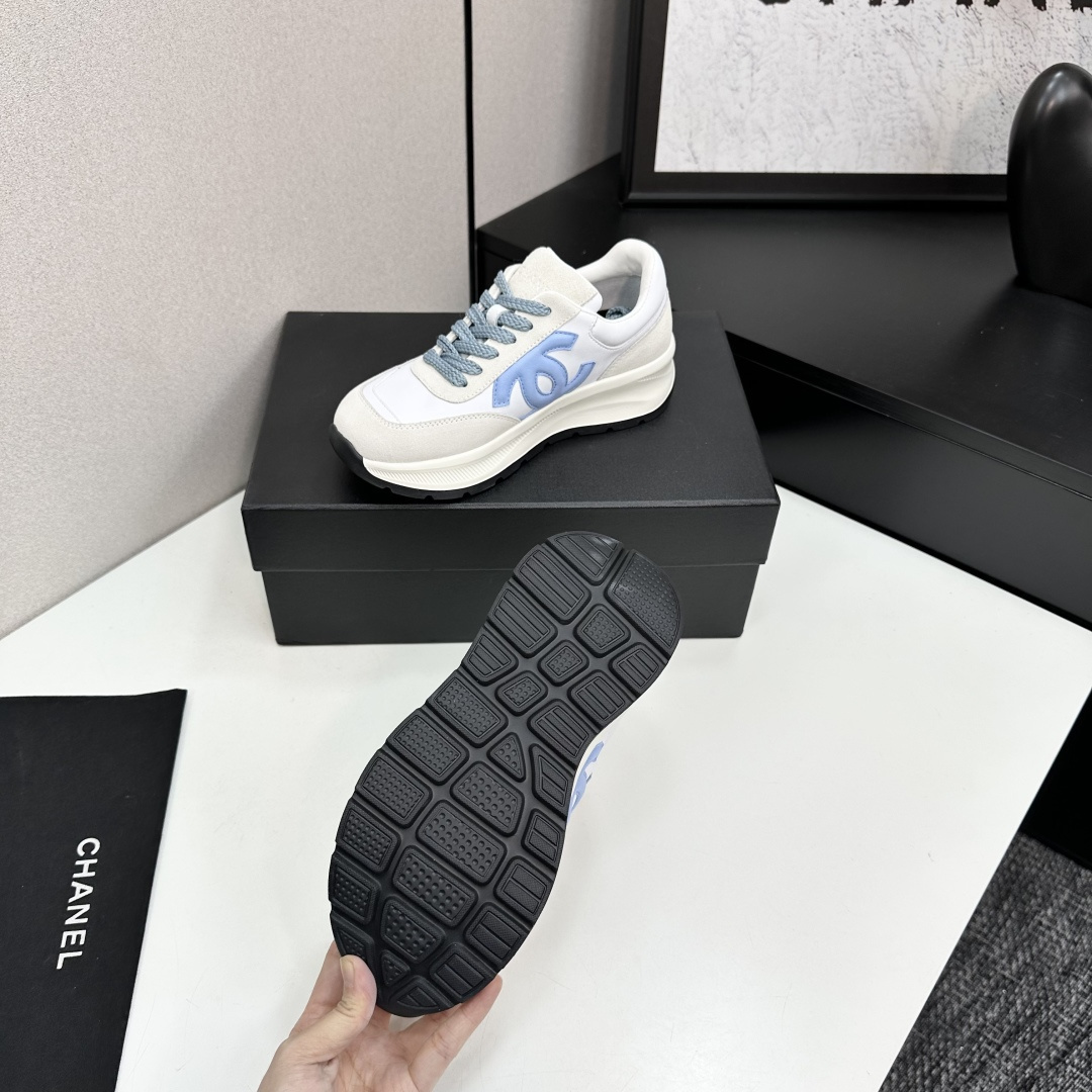 A pair of Chanel sneakers in white and light blue featuring the CC logo on the side - Hình 6