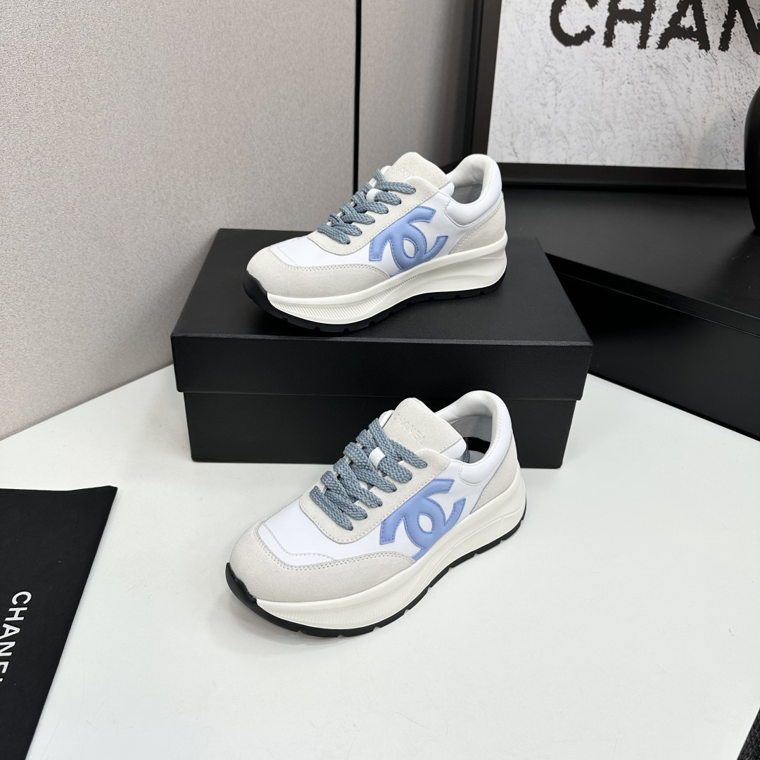 A pair of Chanel sneakers in white and light blue featuring the CC logo on the side - Hình 4