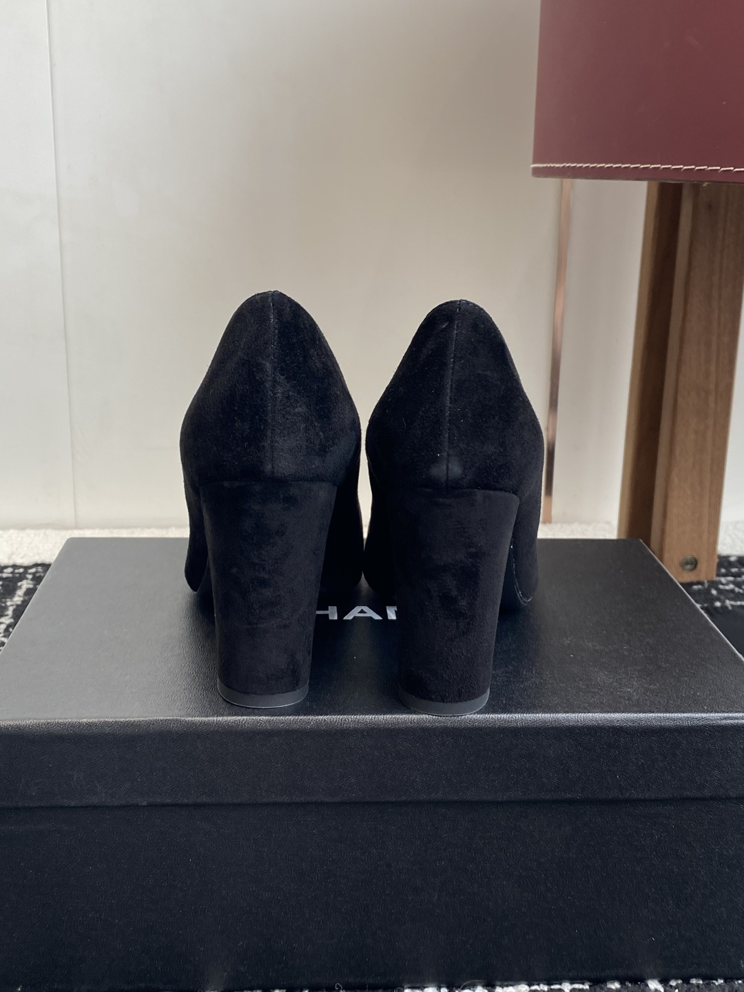 Authentic Chanel black suede pumps with square toe and pink CC logo turn-lock detail on a black box. - Hình 8