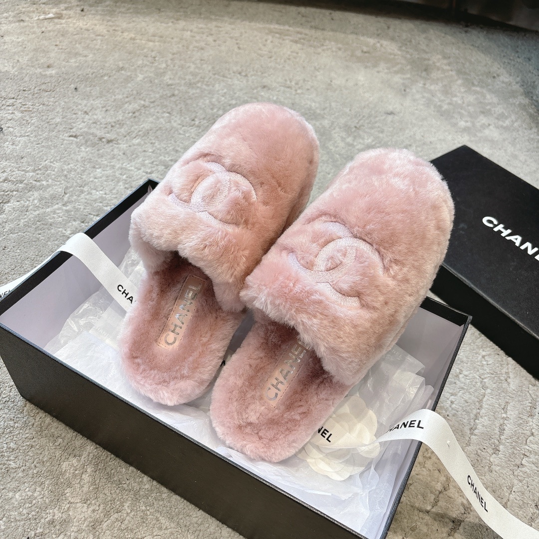 Luxury pink faux fur Chanel slippers with embroidered CC logo presented in a black designer box with white ribbon. - Hình 5