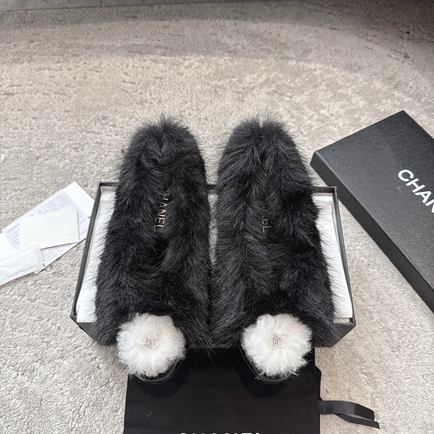 Chanel Black Faux Fur Flats with White Pom-Pom Accent – Luxury Shoes