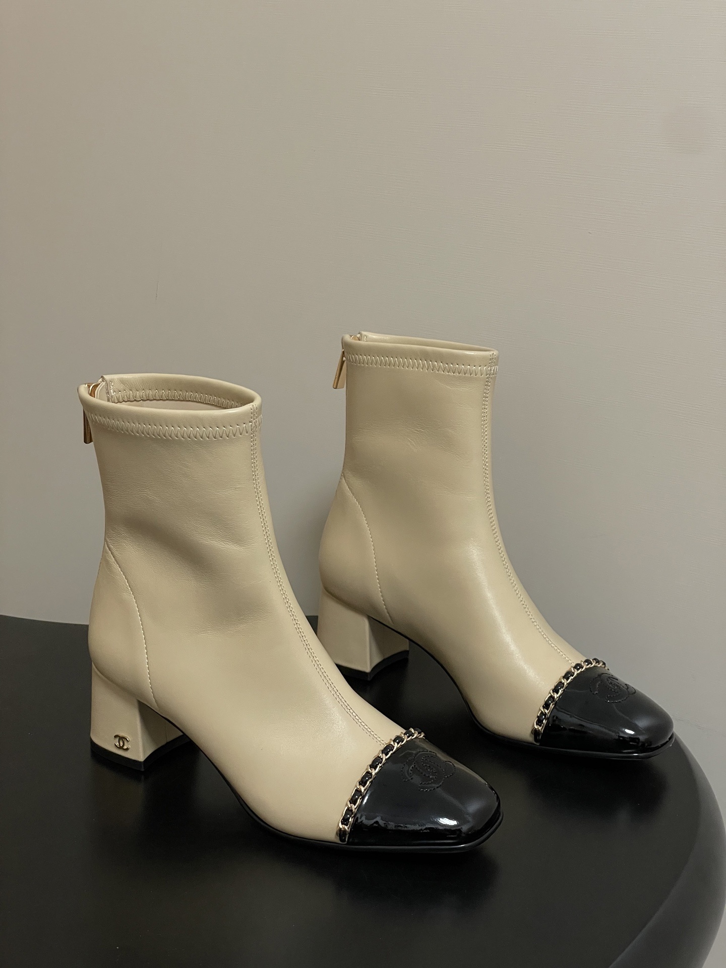 Elegant Cream Leather Ankle Boots with Black Patent Cap Toe