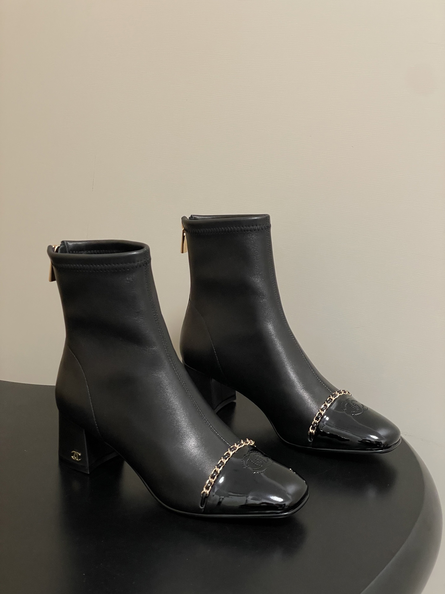 Elegant Black Leather Ankle Boots with Gold Chain and Block Heel