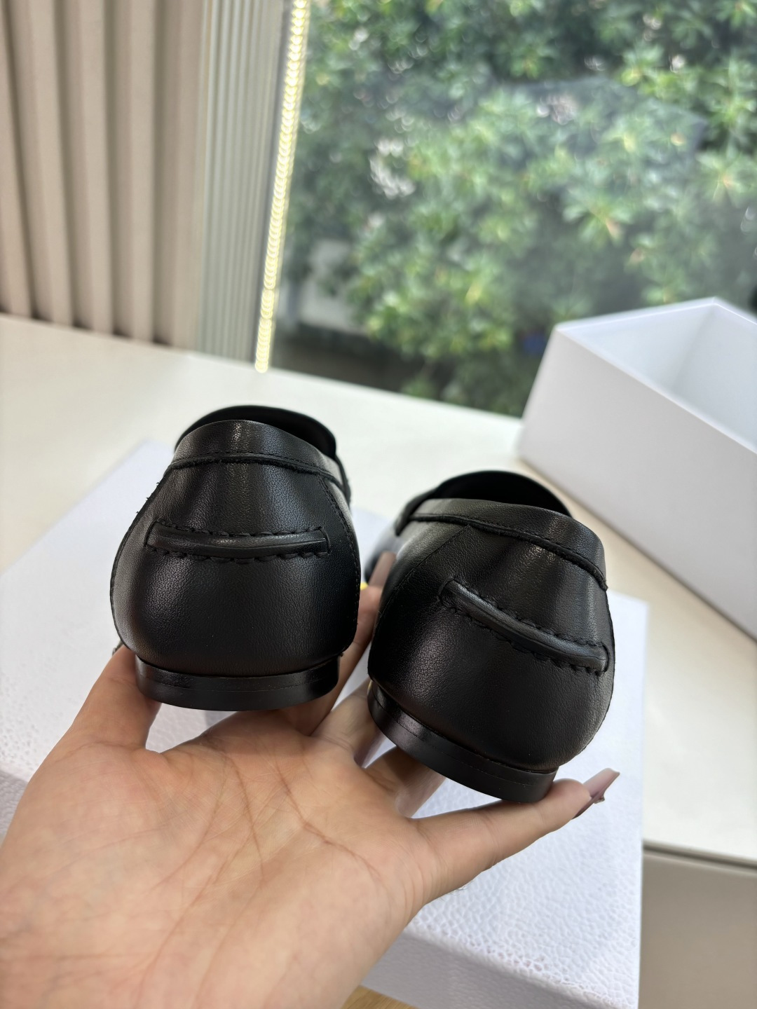 Pair of Christian Dior black leather loafers with gold signature logo in a white box - Hình 9