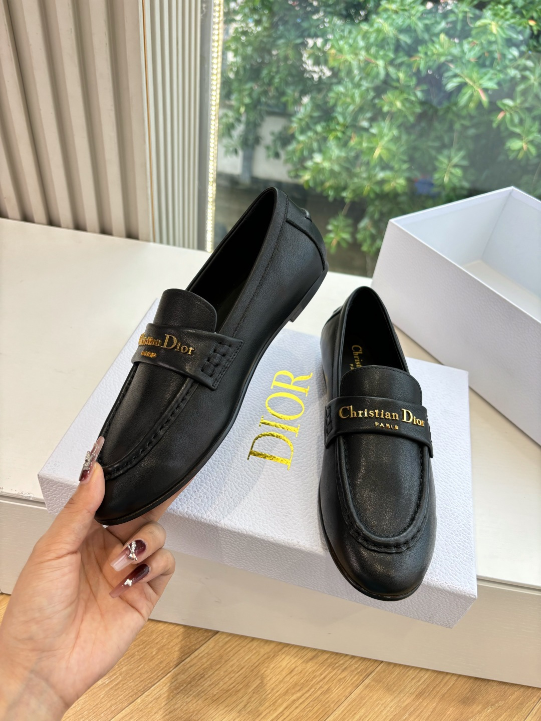 Pair of Christian Dior black leather loafers with gold signature logo in a white box - Hình 5