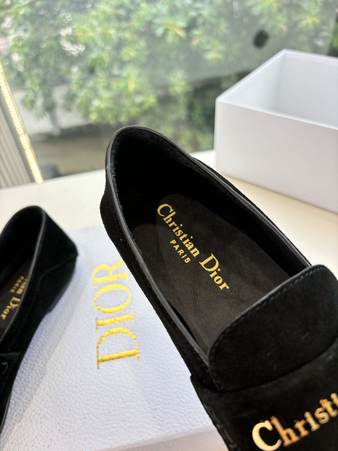 A pair of Christian Dior black suede loafers with gold signature logo in a white luxury box - Hình 9