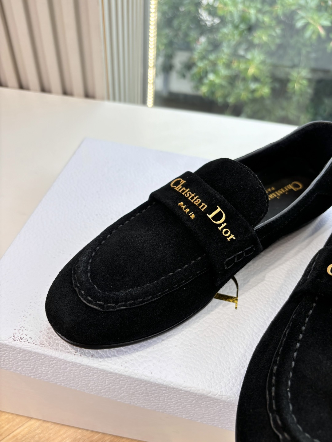 A pair of Christian Dior black suede loafers with gold signature logo in a white luxury box - Hình 8