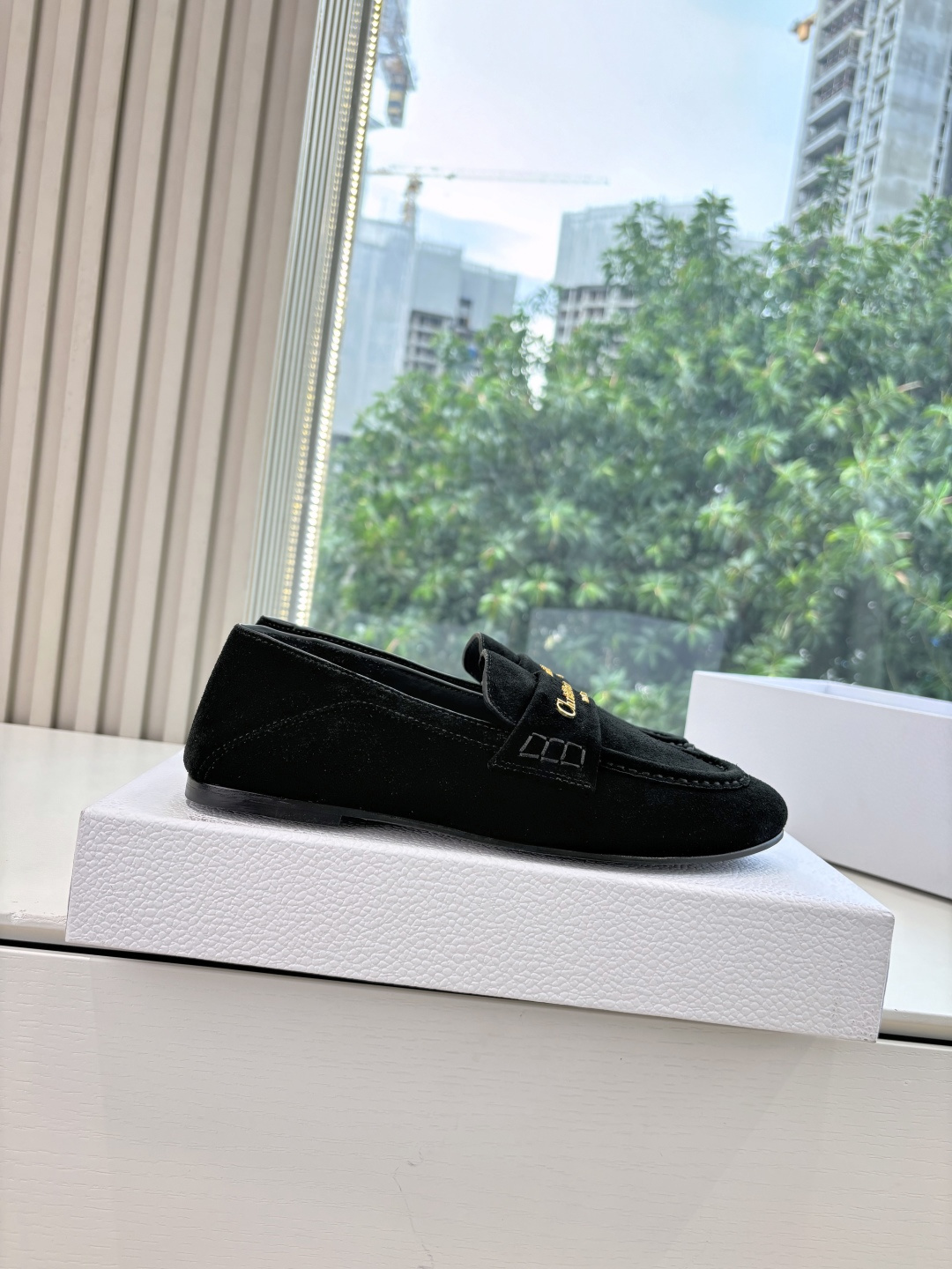 A pair of Christian Dior black suede loafers with gold signature logo in a white luxury box - Hình 7