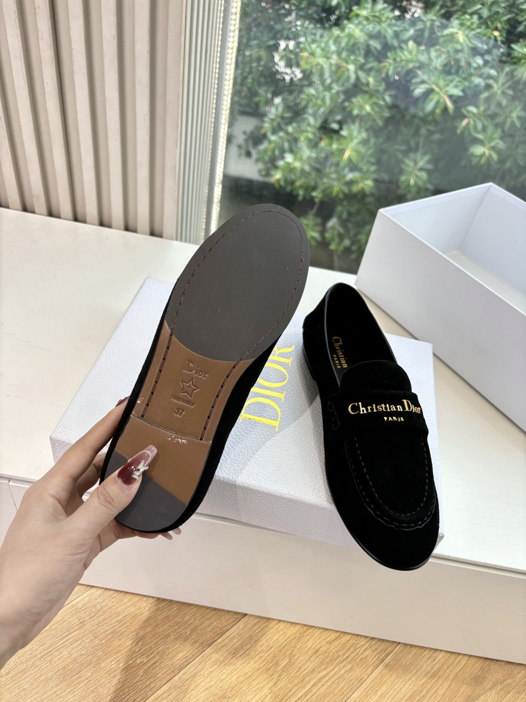 A pair of Christian Dior black suede loafers with gold signature logo in a white luxury box - Hình 6