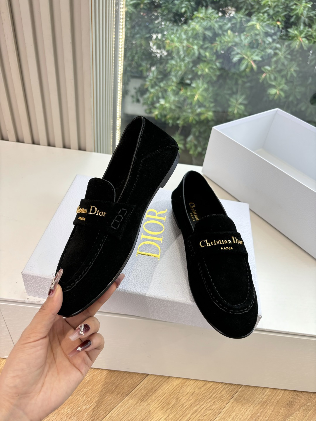 A pair of Christian Dior black suede loafers with gold signature logo in a white luxury box - Hình 5