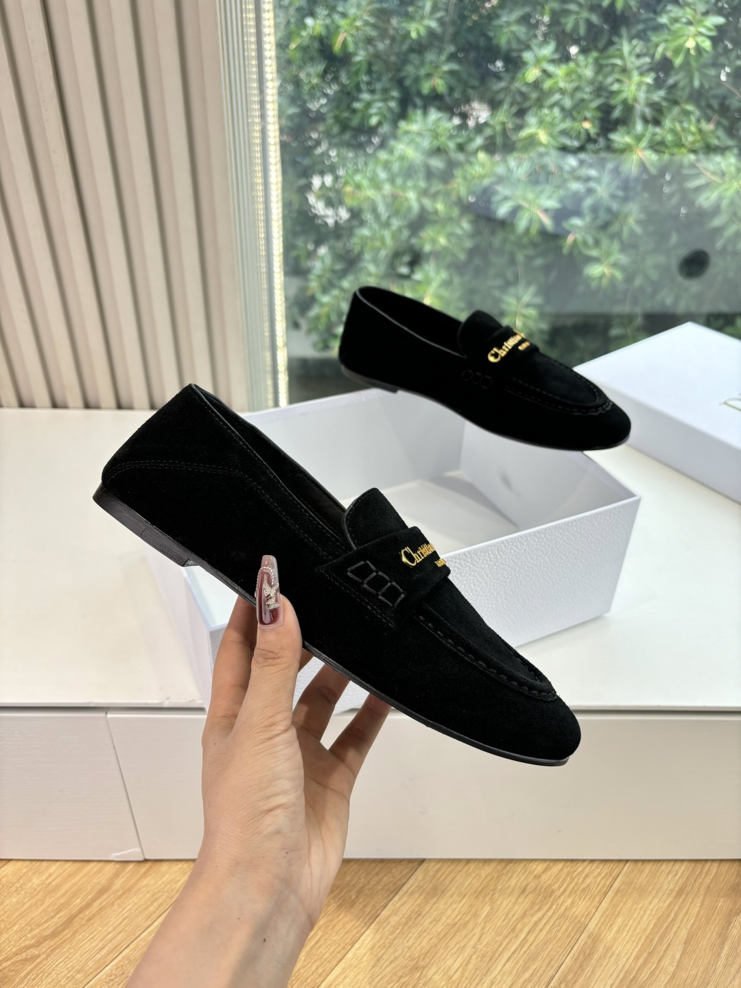 A pair of Christian Dior black suede loafers with gold signature logo in a white luxury box - Hình 3